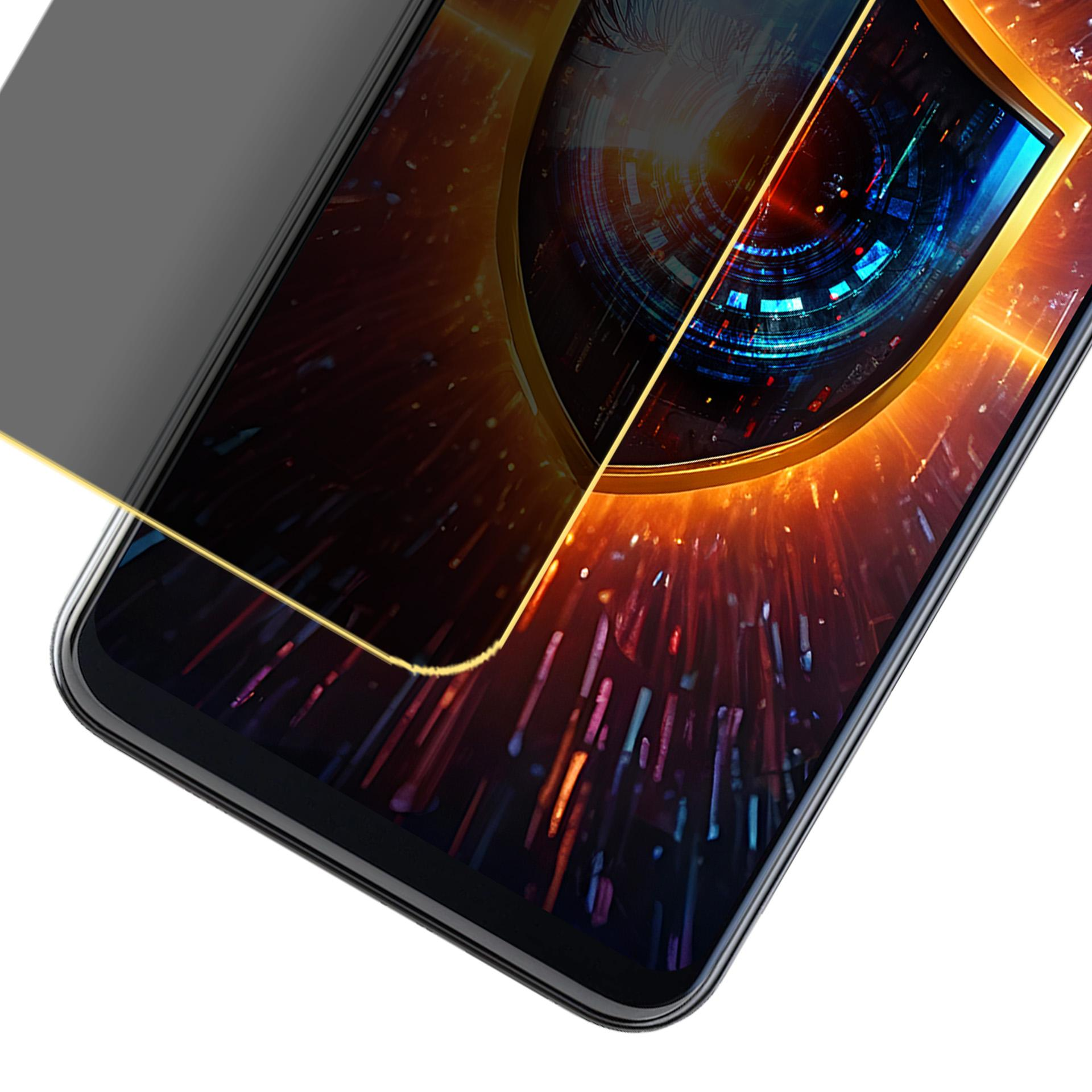 Palec dotyka ekranu telefonu z grafiką w kształcie tarczy. Telefon wyświetla kolorowe tło.