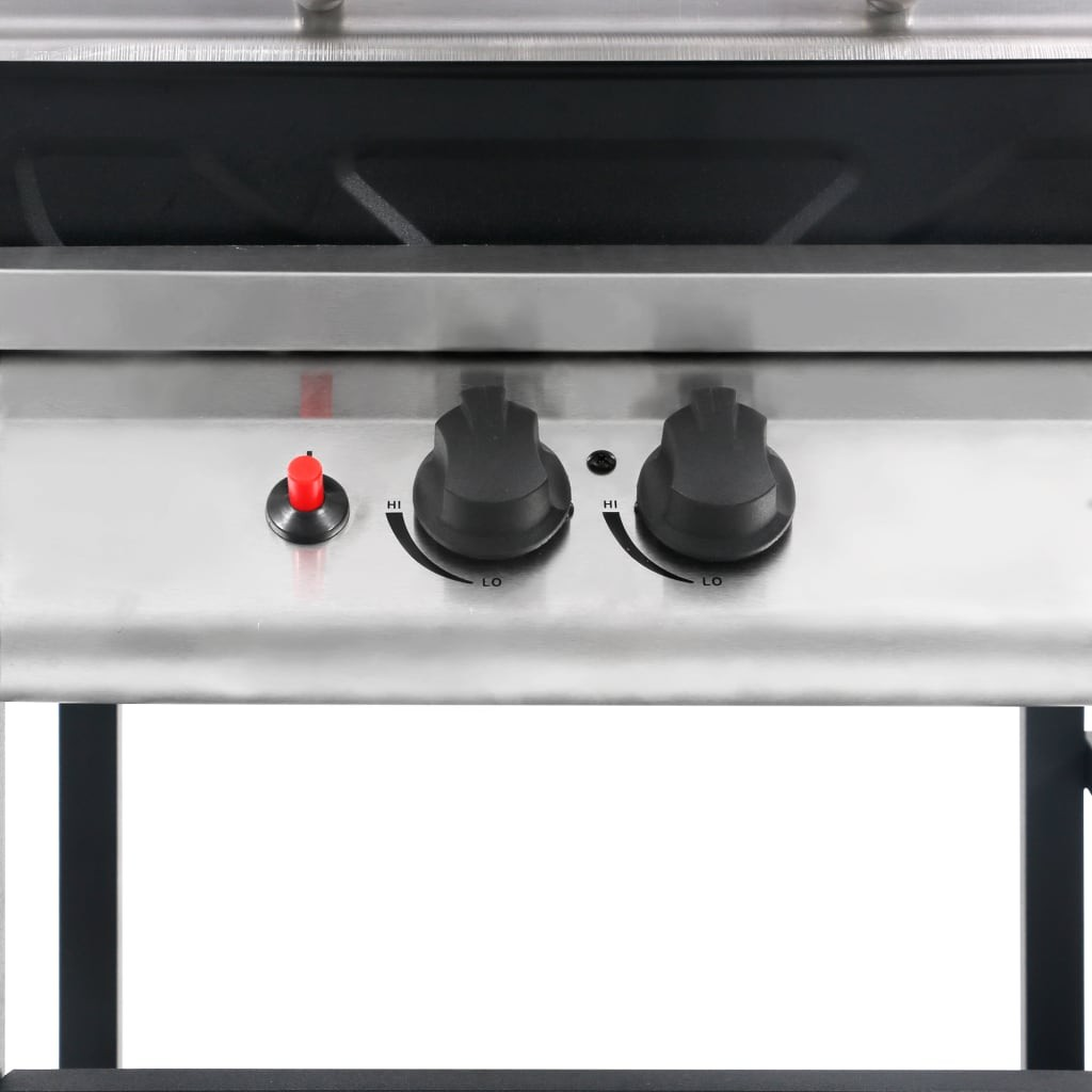 Primo piano delle manopole della griglia. Due manopole nere con indicazioni HI e LO e un pulsante di accensione rosso.