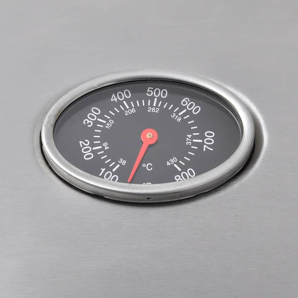 Un primo piano del termometro della griglia che mostra la temperatura. L'ago punta a 200, suggerendo che la griglia sia calda.