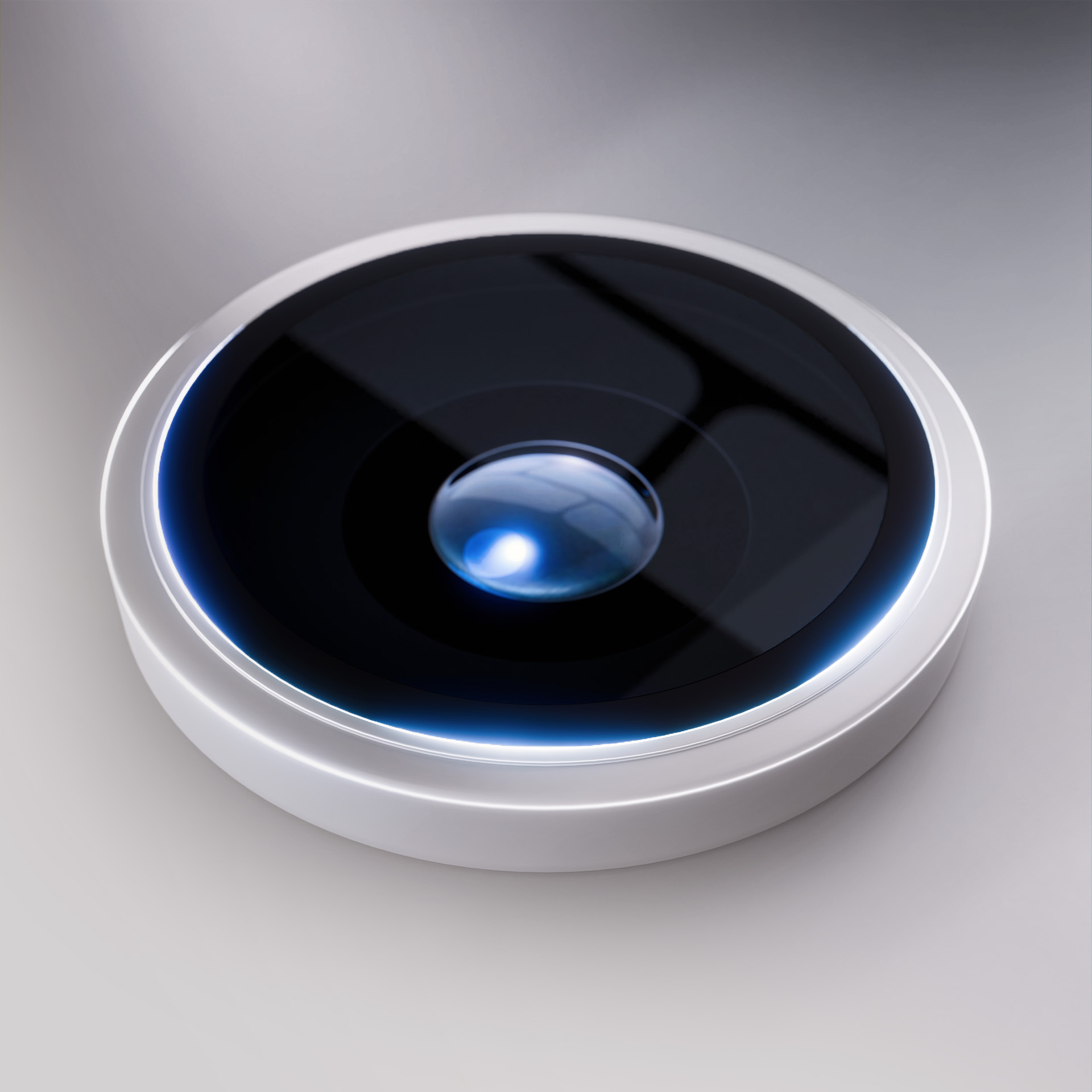 Primo piano di un obiettivo, nero con superficie riflettente, circondato da un anello argentato e luce blu.