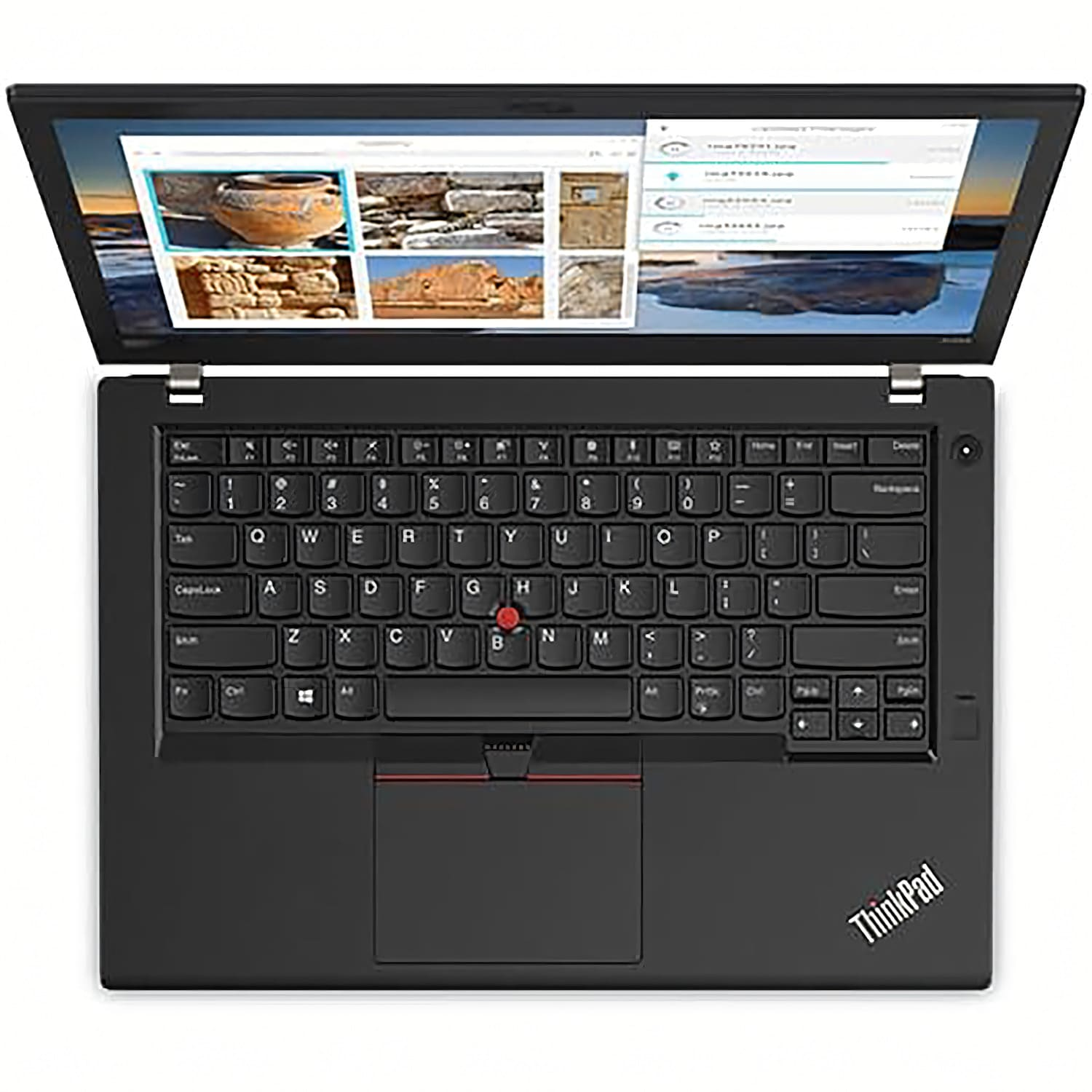 Ordenador portátil negro con una página web en la pantalla. Teclado y trackpad negros visibles. Fondo blanco.