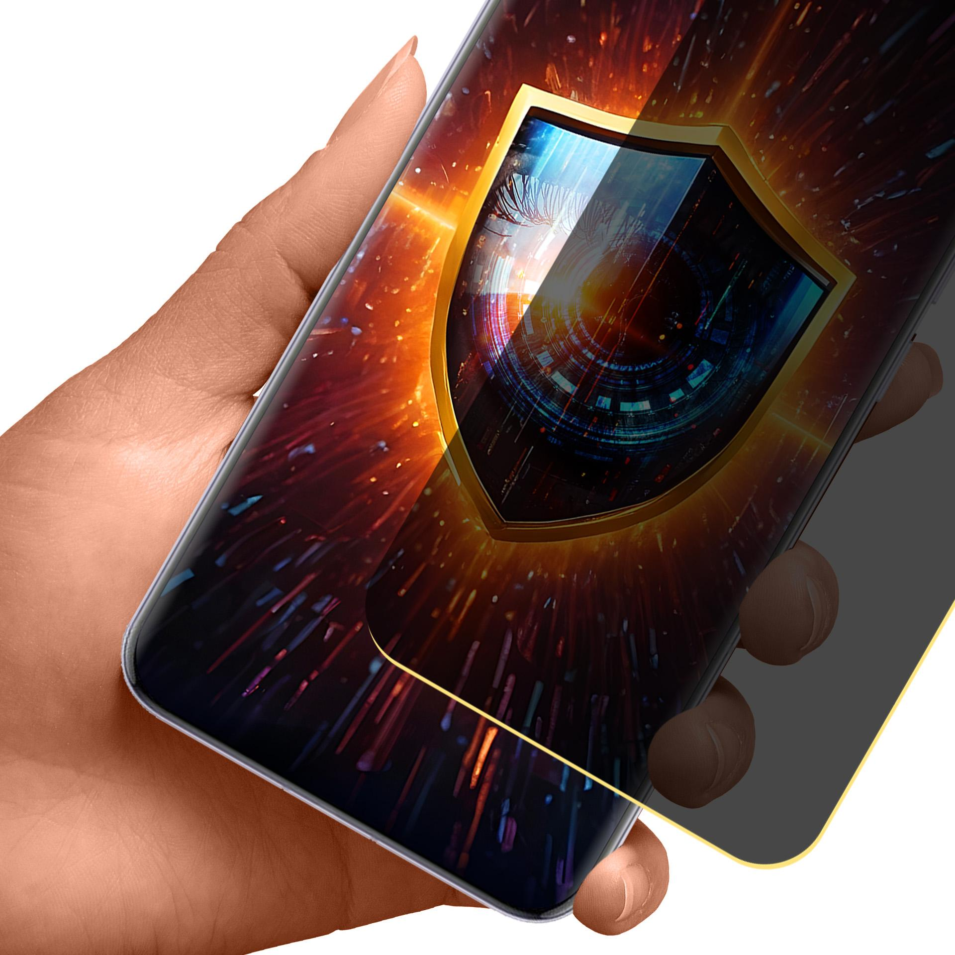 Dłoń trzymająca telefon z grafiką tarczy na ekranie. Tarcza ma złoty kontur. Tło jest czerwone i niebieskie.