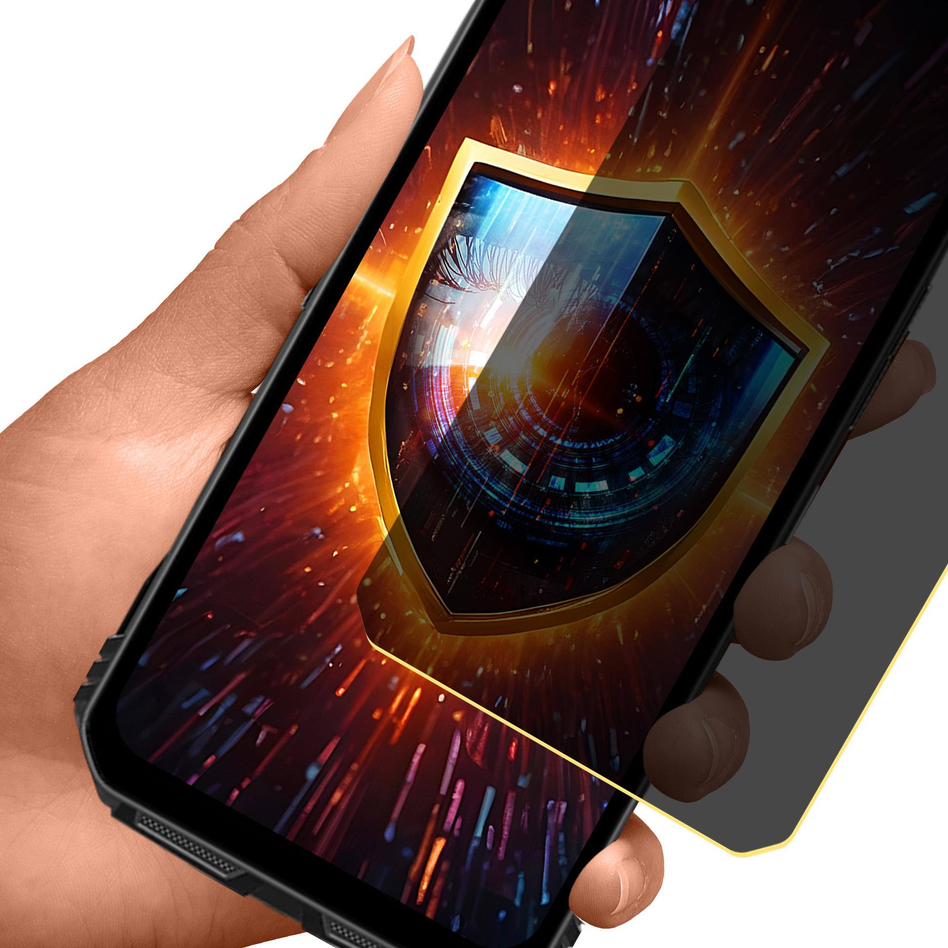 Dłoń trzyma smartfon. Ekran wyświetla ikonę tarczy na kolorowym tle o tematyce technicznej. Zastosowano ochronę ekranu.