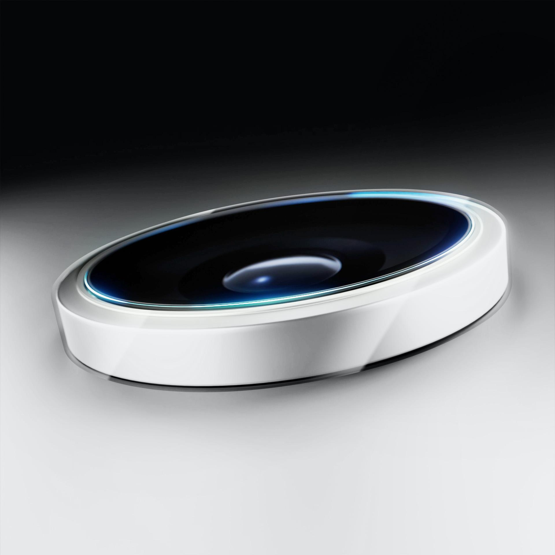 Białe, owalne urządzenie z czarnym, błyszczącym środkiem. Niebieskie światło obrysowuje górną krawędź. Tło od czarnego do białego.