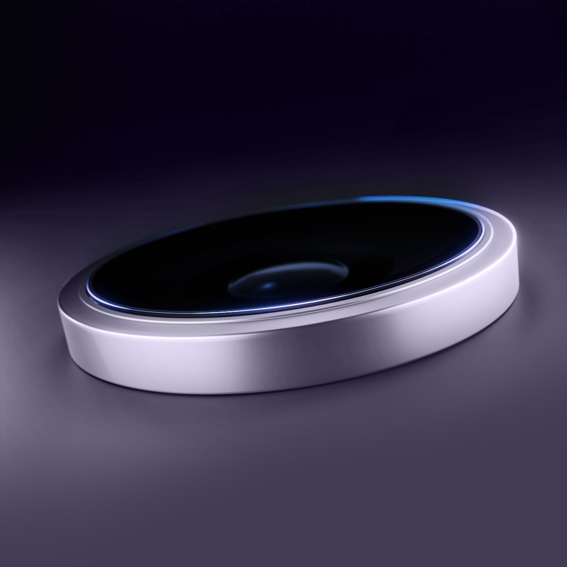 Un dispositivo futuristico con una parte superiore nera lucida e una base argentata, su una superficie viola scuro.