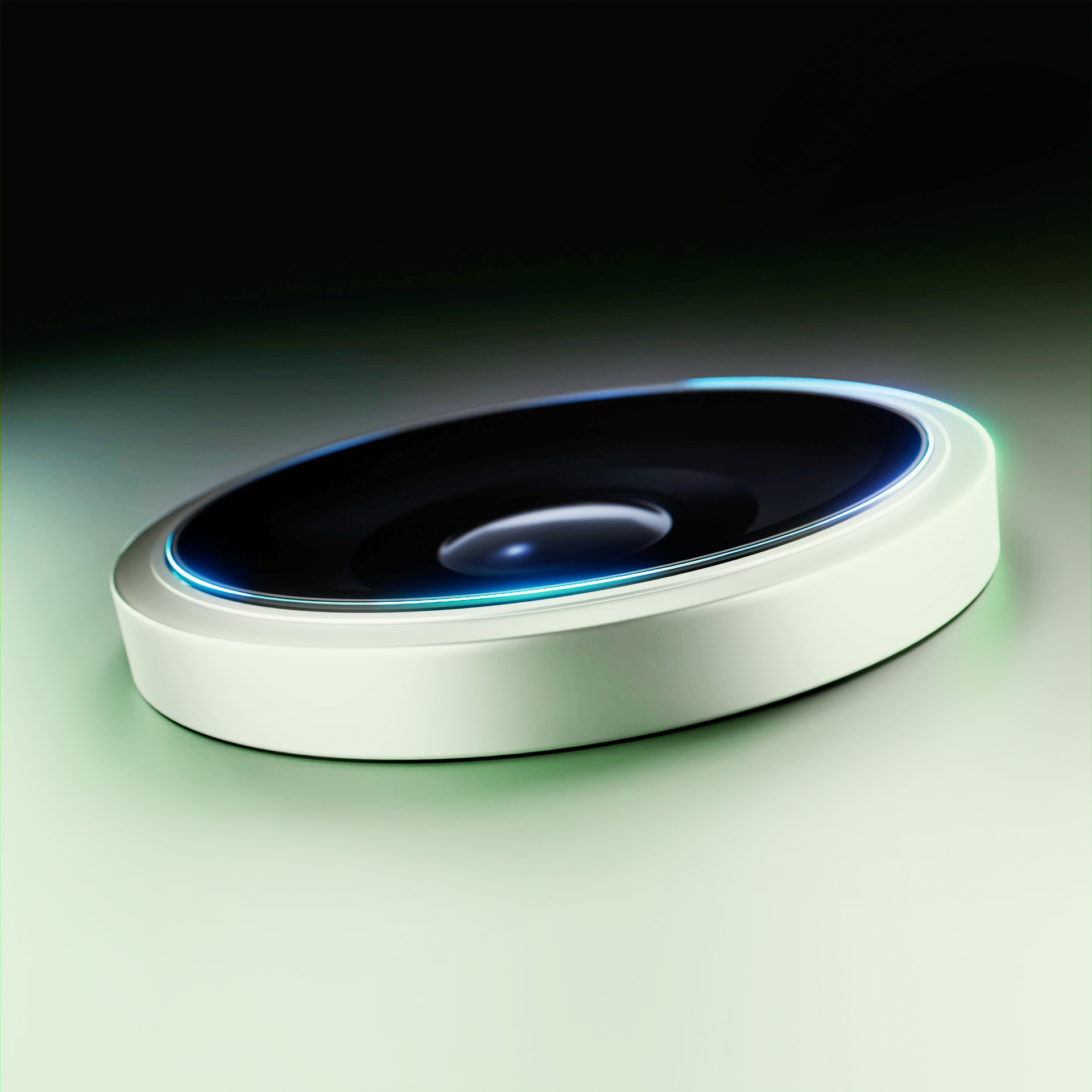 Un dispositivo bianco e circolare con centro nero e bordo blu-verde, su sfondo sfumato.
