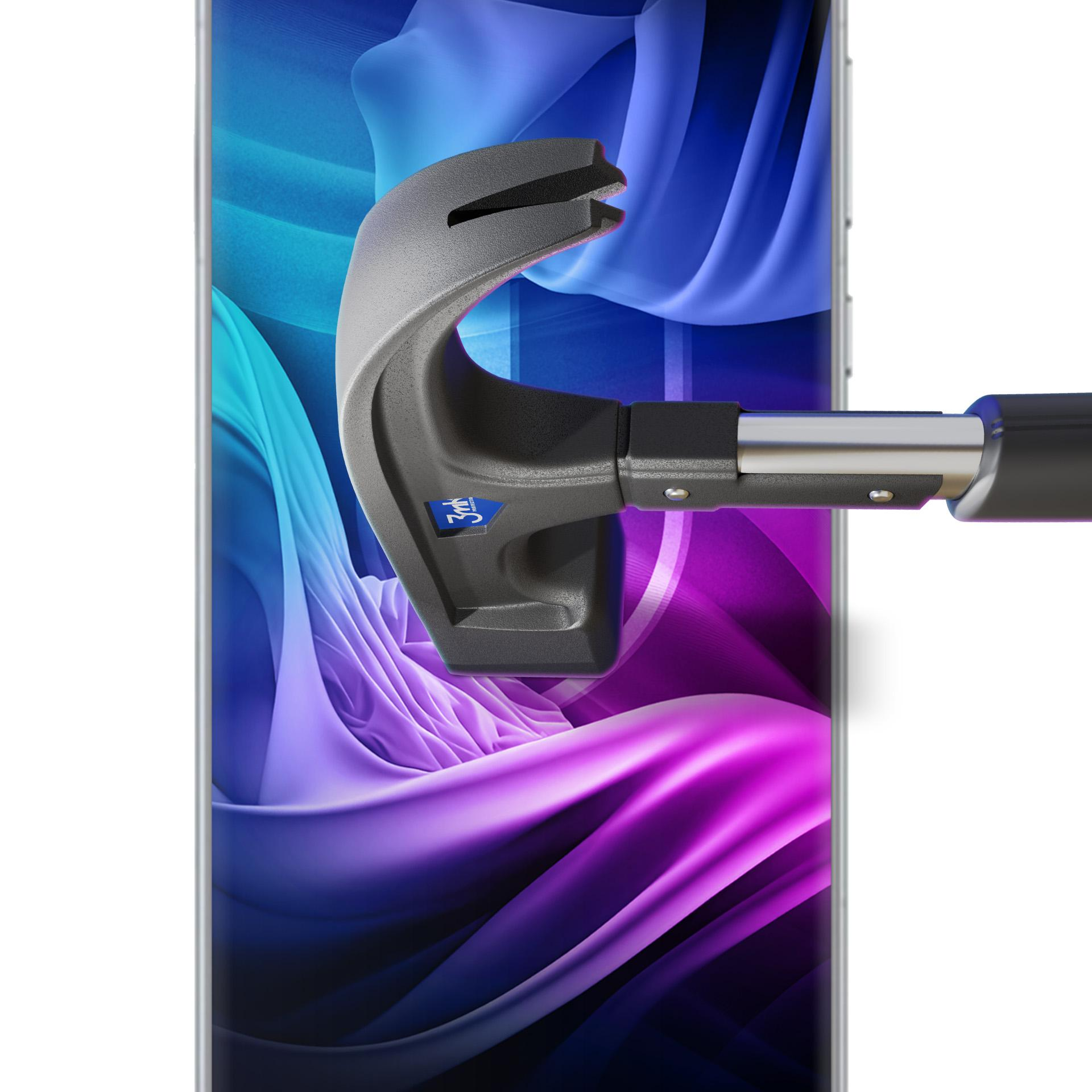 Telefon z kolorowym tłem jest testowany narzędziem. Narzędzie jest czarne i szare.