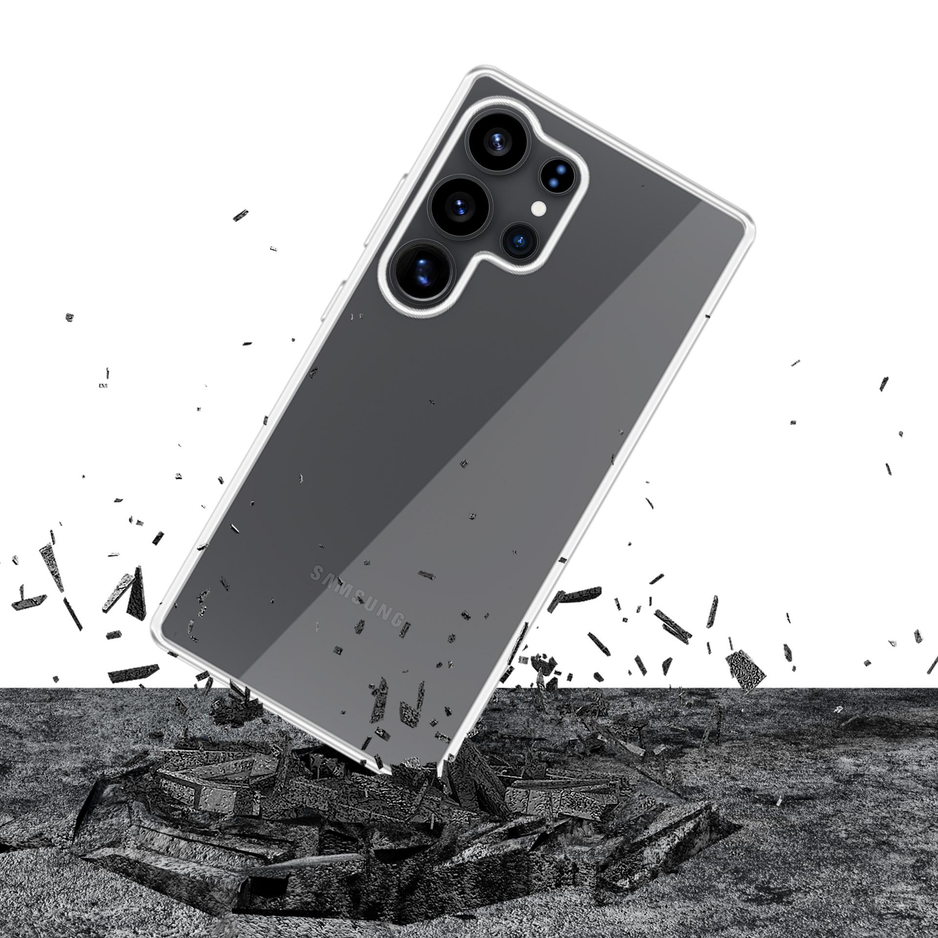 Un telefono in una custodia cade e rompe una superficie di pietra. Detriti neri sparsi.