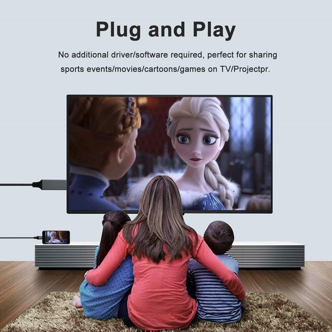 Drei Kinder schauen einen Cartoon im Fernsehen. Ein Telefon ist angeschlossen. Text sagt 'Plug and Play'.