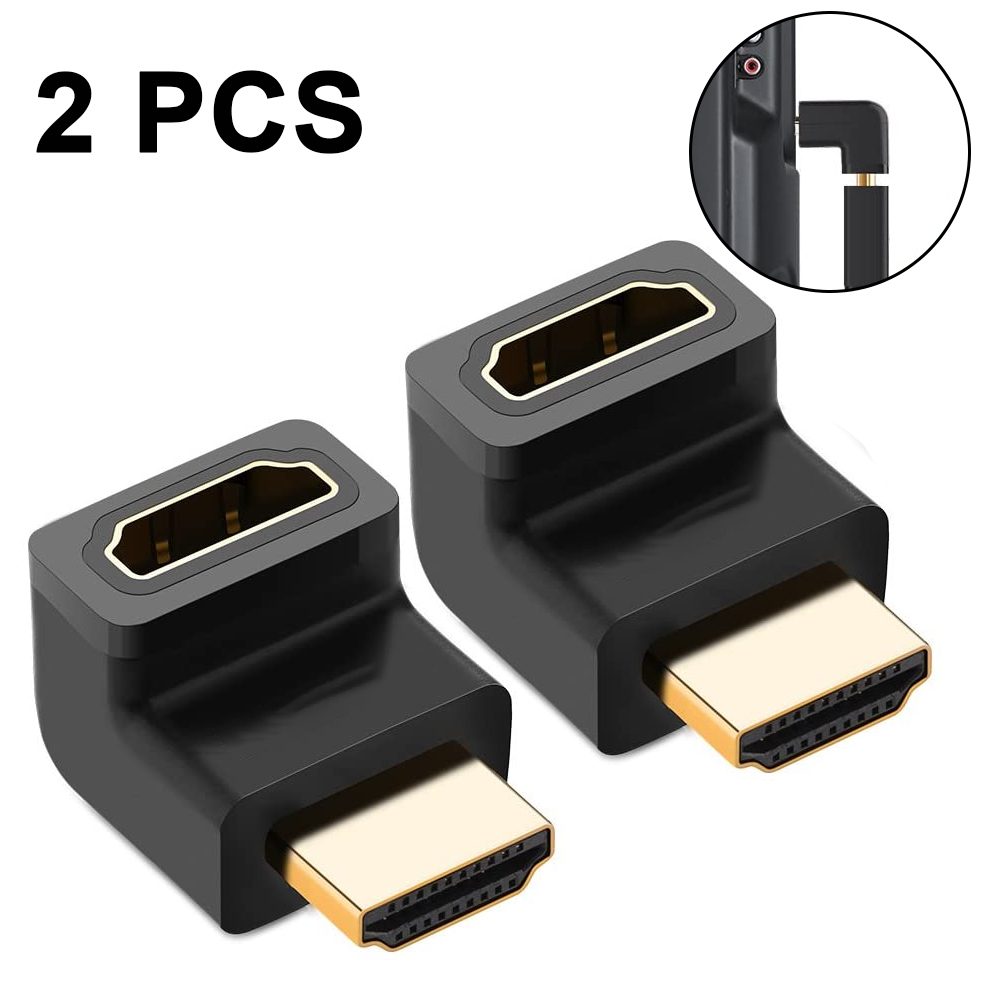 Zwei schwarze HDMI-Adapter mit goldenen Anschlüssen. Ein Adapter ist im Hintergrund an ein Gerät angeschlossen.