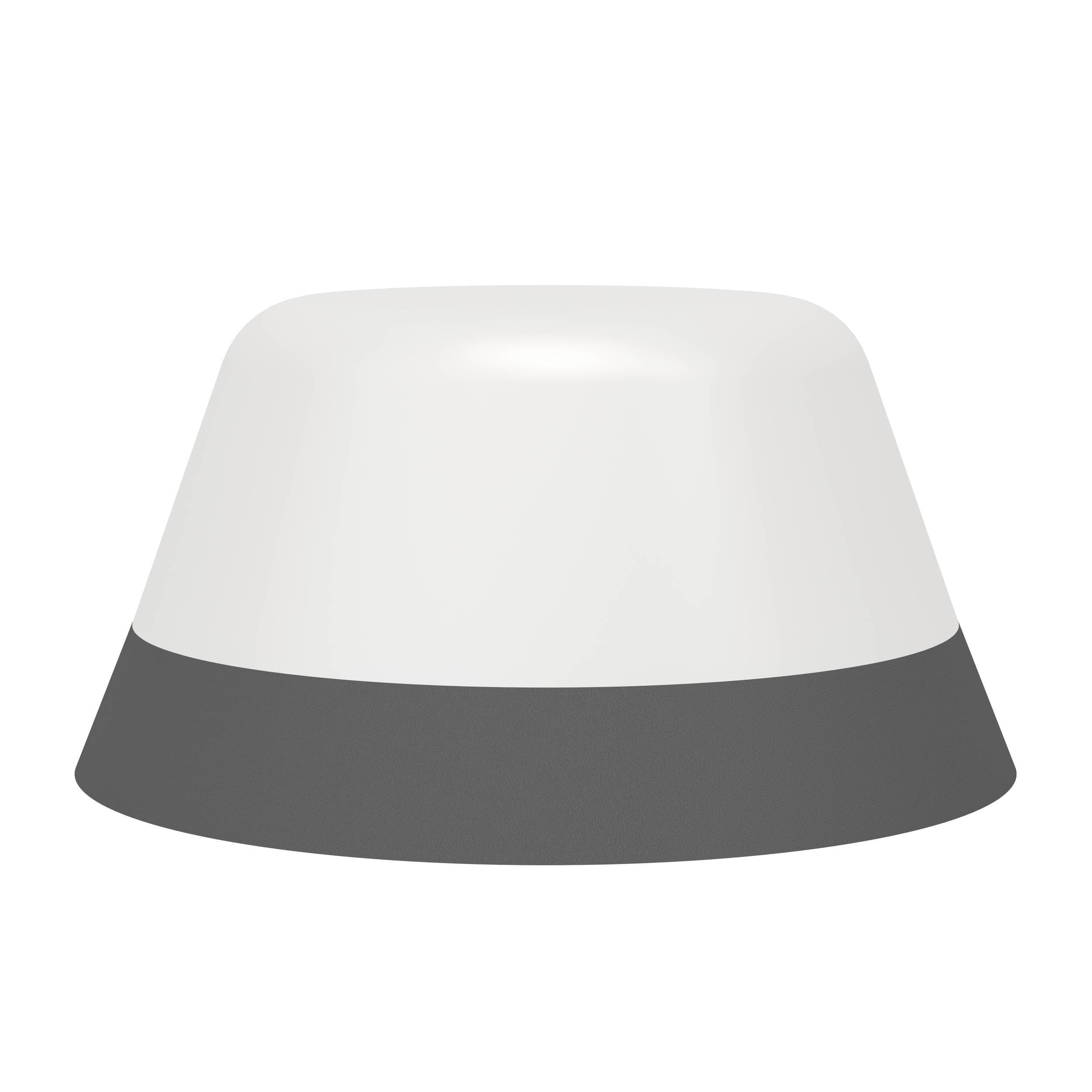 Ein weiß-graues Objekt, möglicherweise eine Lampe, vor weißem Hintergrund. Der Boden ist grau.