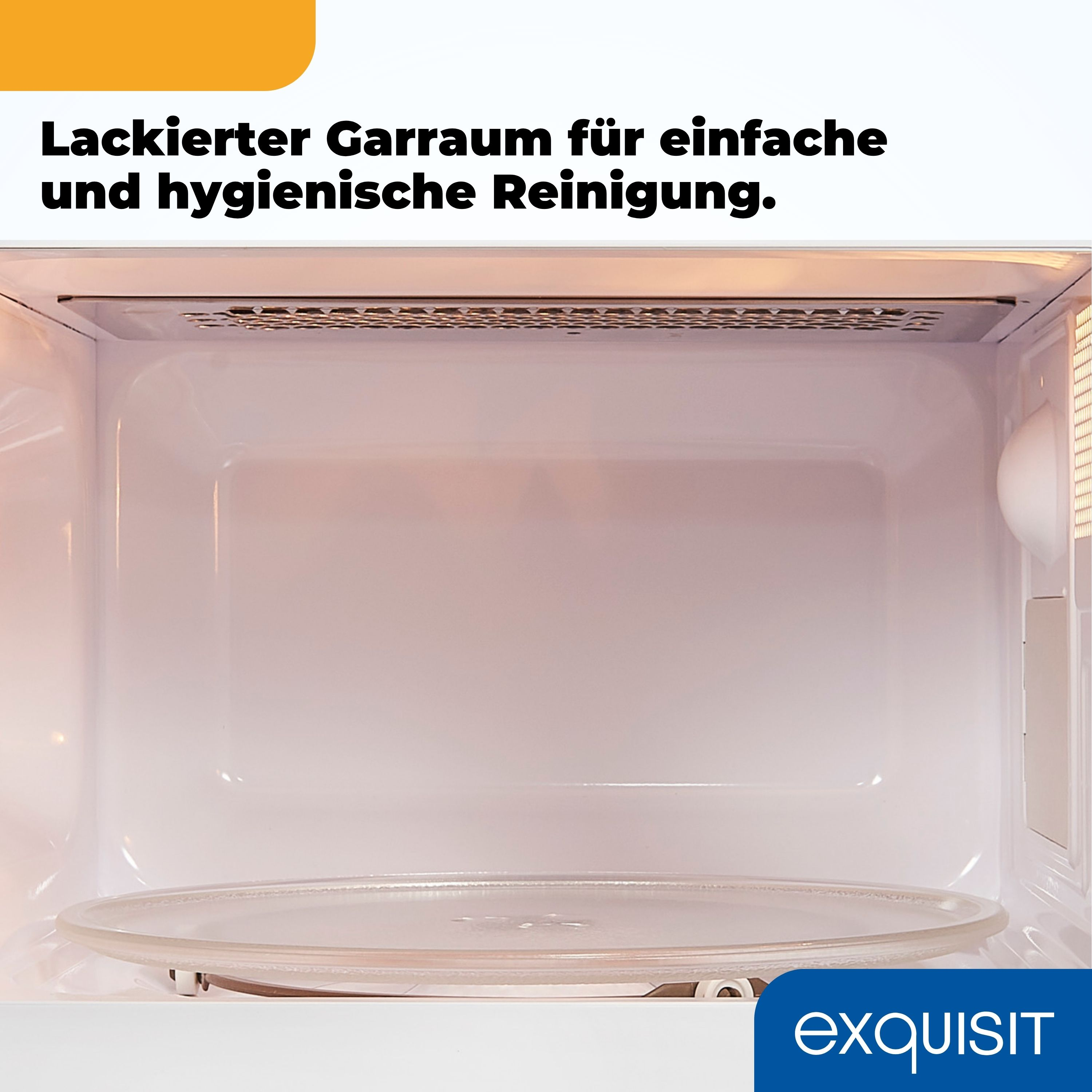 Innenraum eines Mikrowellenherds. Glasplatte in der Mitte. Weißes Innere. Oben ein Metallgitter.