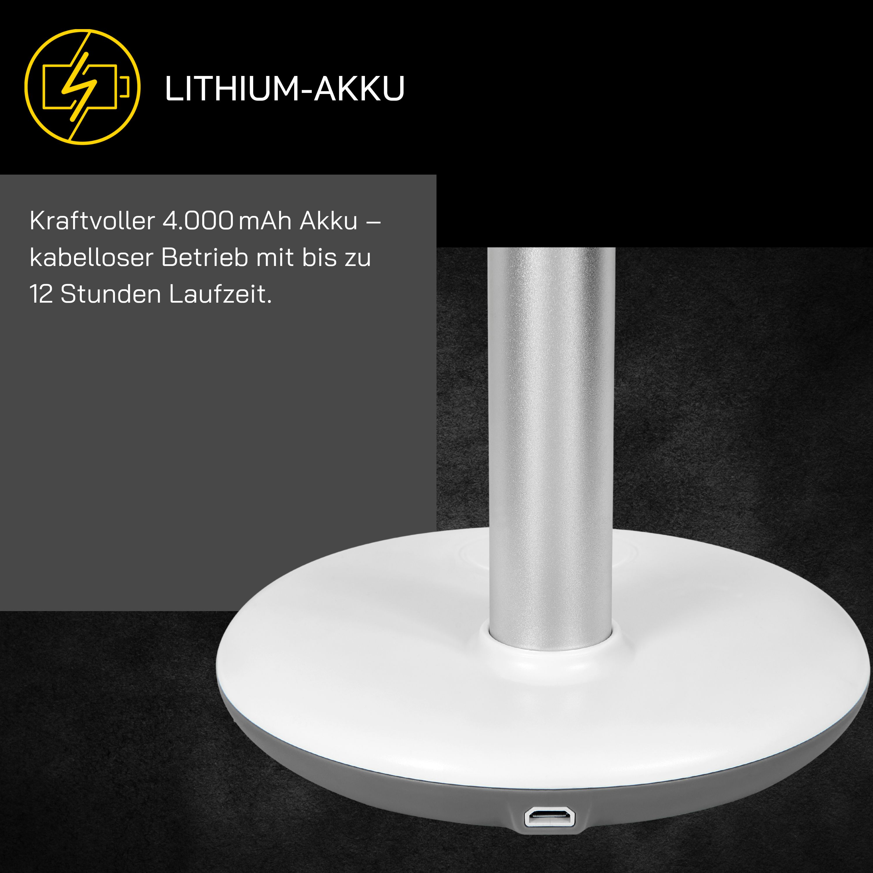 Una base de lámpara con parte superior blanca y base gris. Un poste plateado se extiende hacia arriba. Texto: LITHIUM-AKKU.