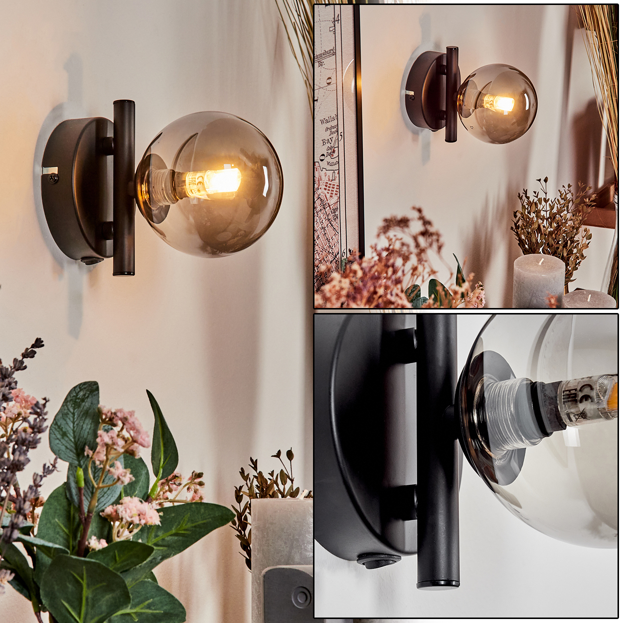 Wandlampe mit Rauchglaskugel. Die Lampe hängt an einer weißen Wand, Deko im Hintergrund.