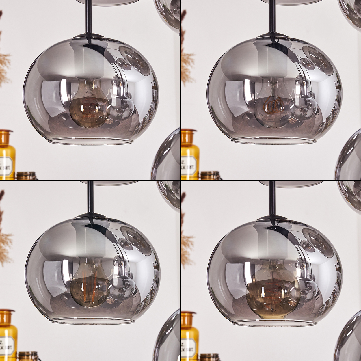 Vier Pendelleuchten mit kugelförmigen Glasschirmen, sichtbaren Glühbirnen, angeordnet in einem quadratischen Format.