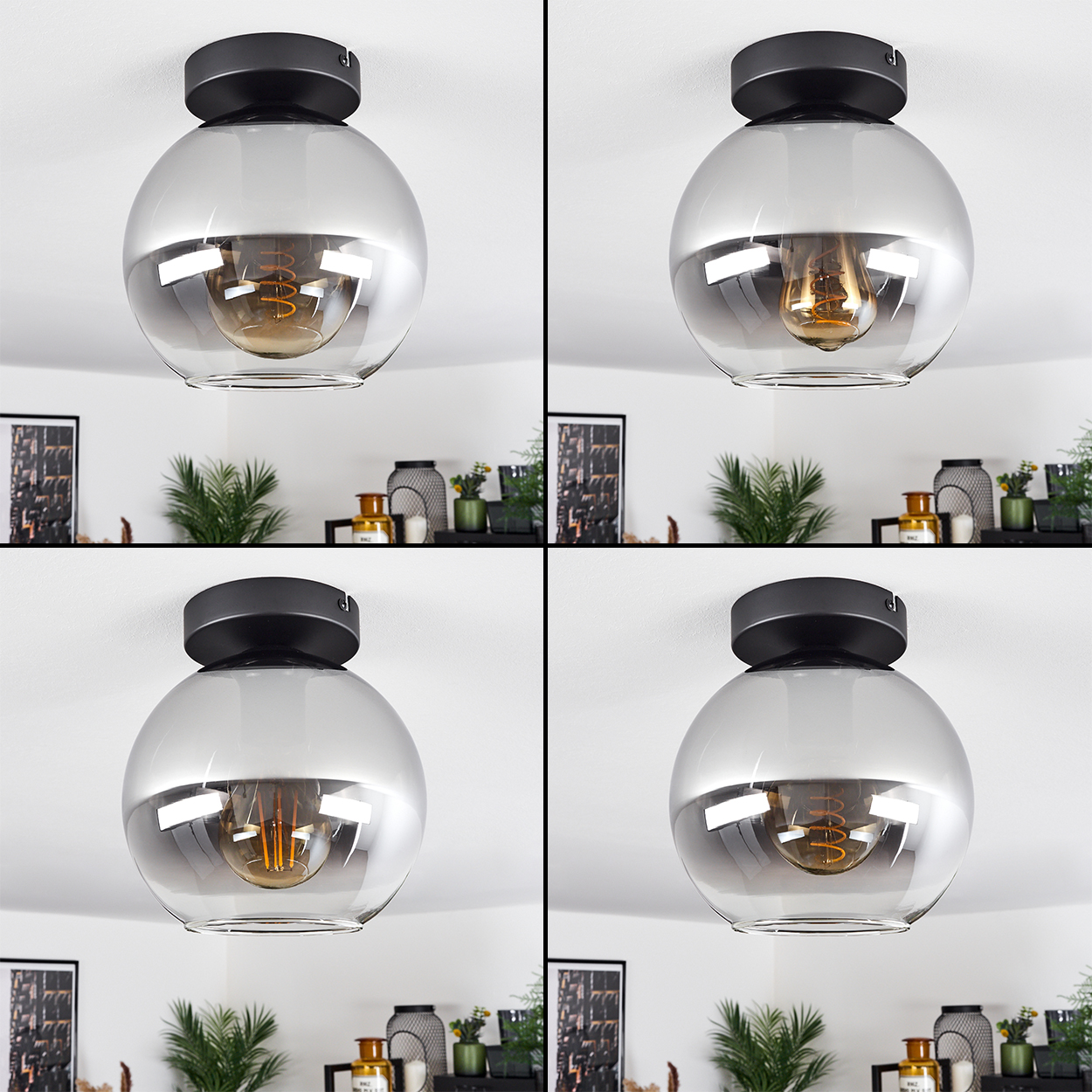 Vier Deckenlampen mit kugelförmigen Glasschirmen, schwarzen Sockeln und sichtbaren Wendelglühbirnen.