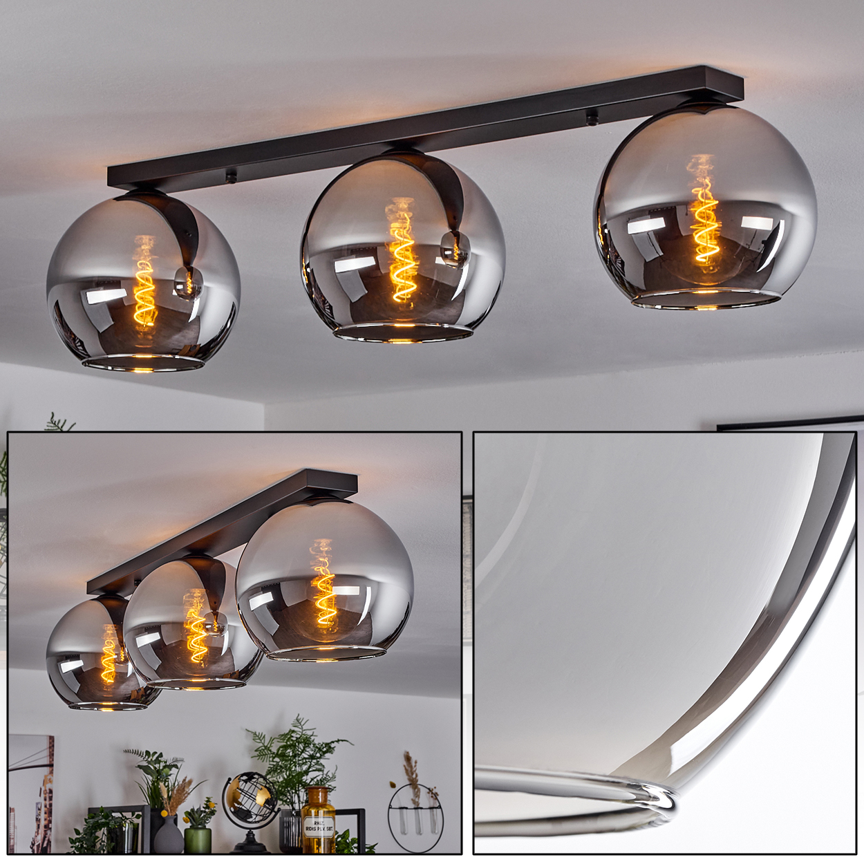 Deckenleuchten mit drei runden Glühbirnen. Die Glühbirnen haben eine metallische, reflektierende Oberfläche. Die Decke ist weiß, mit einem schwarzen Balken.