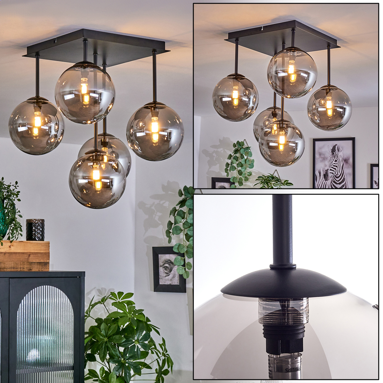 Deckenlampe mit sechs Glaskugeln. Möbel im Hintergrund. Pflanzen sind ebenfalls sichtbar. Weiches Licht scheint.