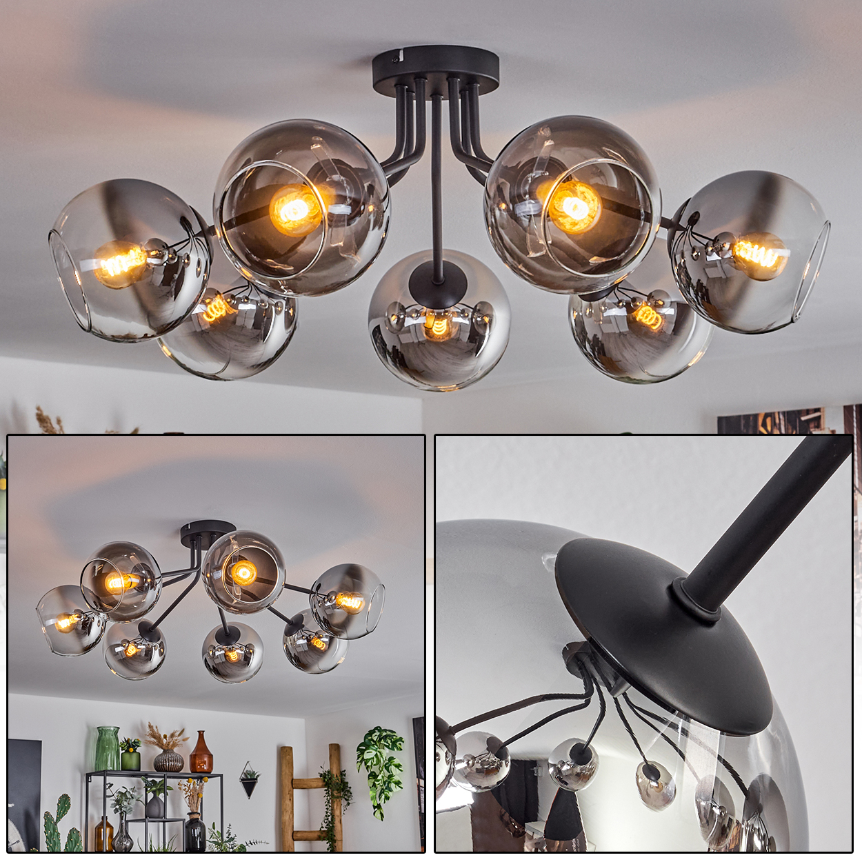 Deckenleuchte mit sieben Kugelleuchten. Die Kugeln sind klar und silber mit schwarzem Rahmen.