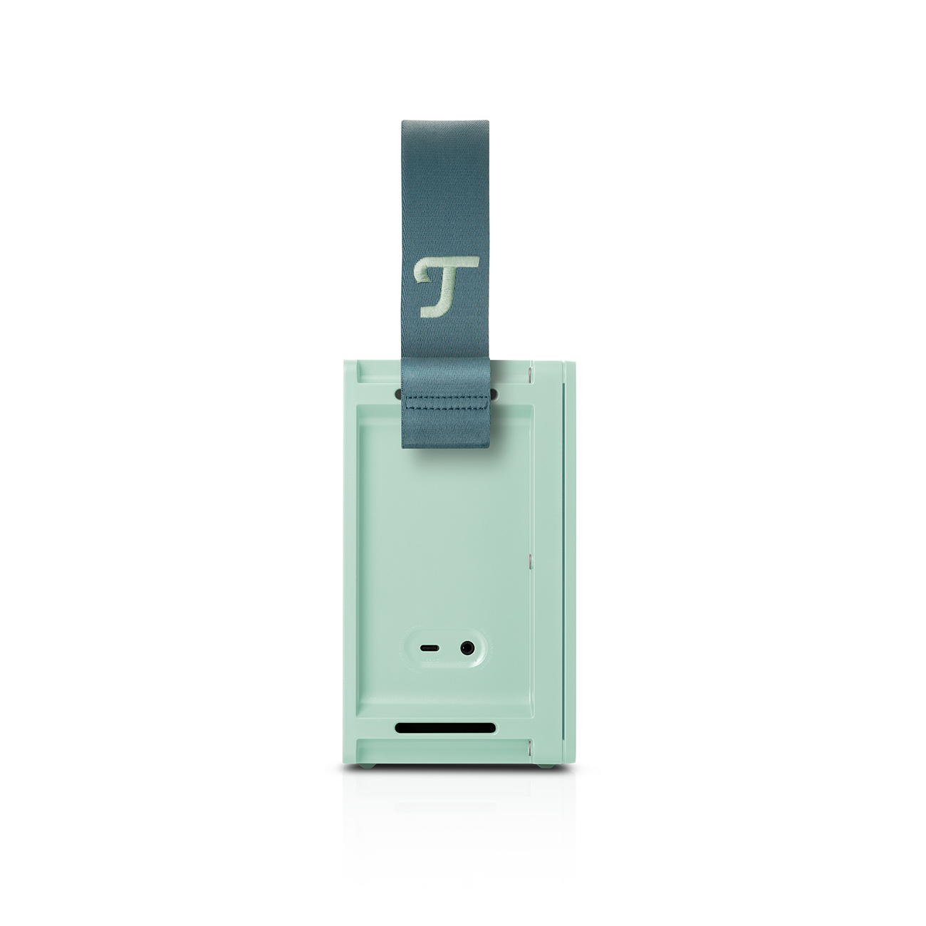 Un haut-parleur vert menthe avec une sangle grise. Il a un bouton et un port en bas.