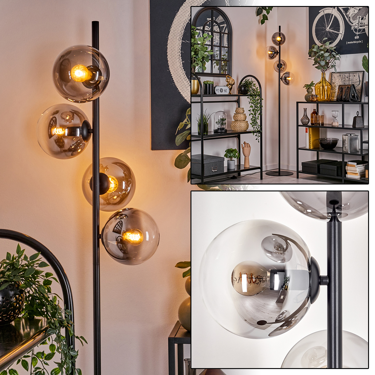Eine Stehlampe mit mehreren Glaskugelschirmen, beleuchteten Glühbirnen und einem schwarzen Pfosten an einer Wand.
