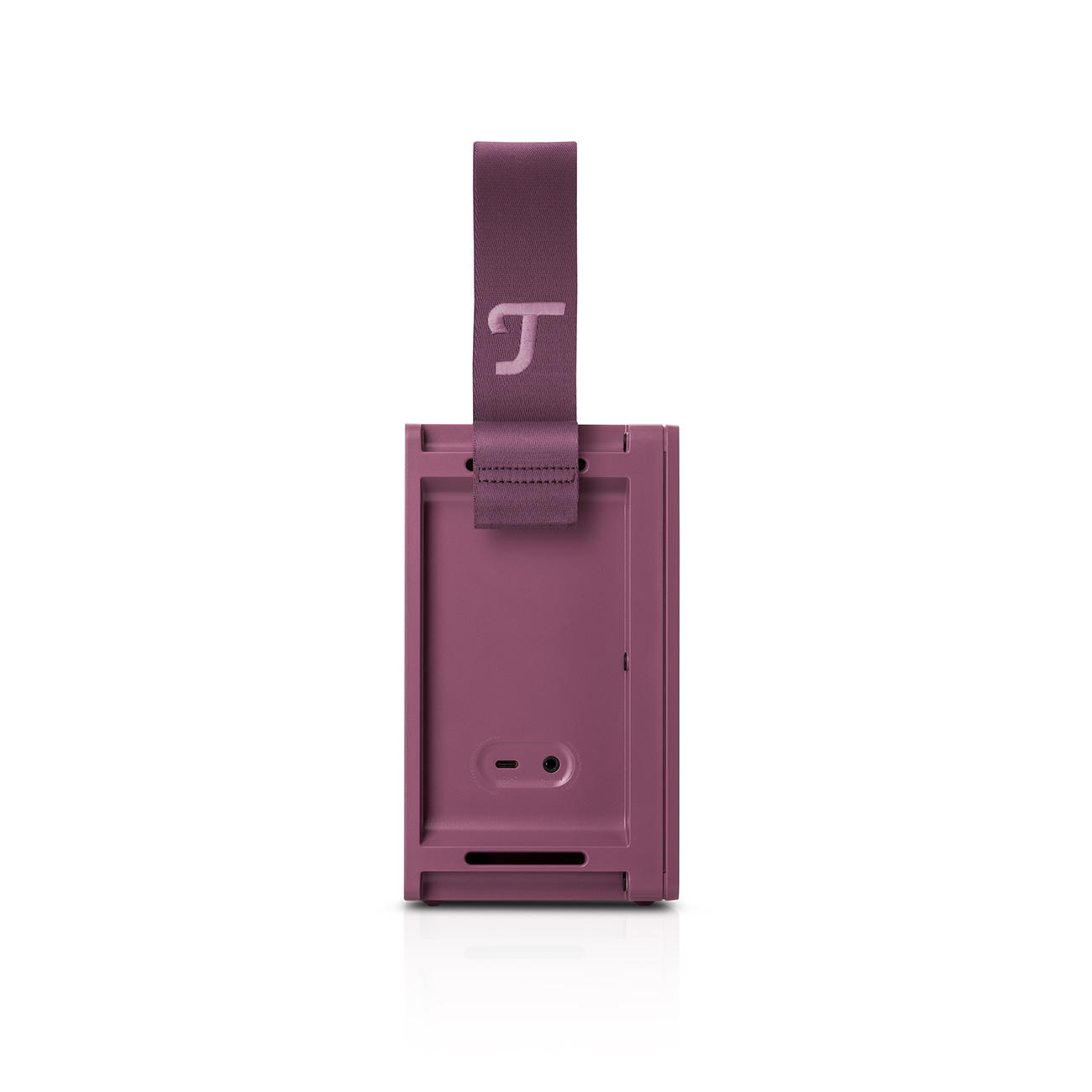 Un haut-parleur violet avec une poignée et un logo. Le haut-parleur est sur une surface blanche.