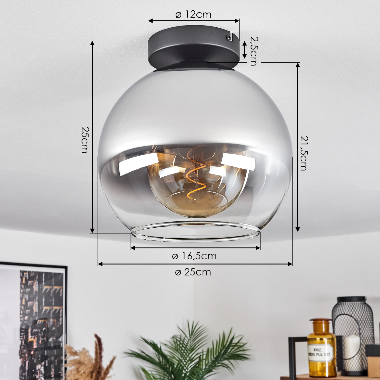 Eine Glaskugel-Deckenleuchte mit dunklem Metallsockel. Abmessungen sind beschriftet: 12cm, 25cm, 16,5cm, 21,5cm und 25cm.