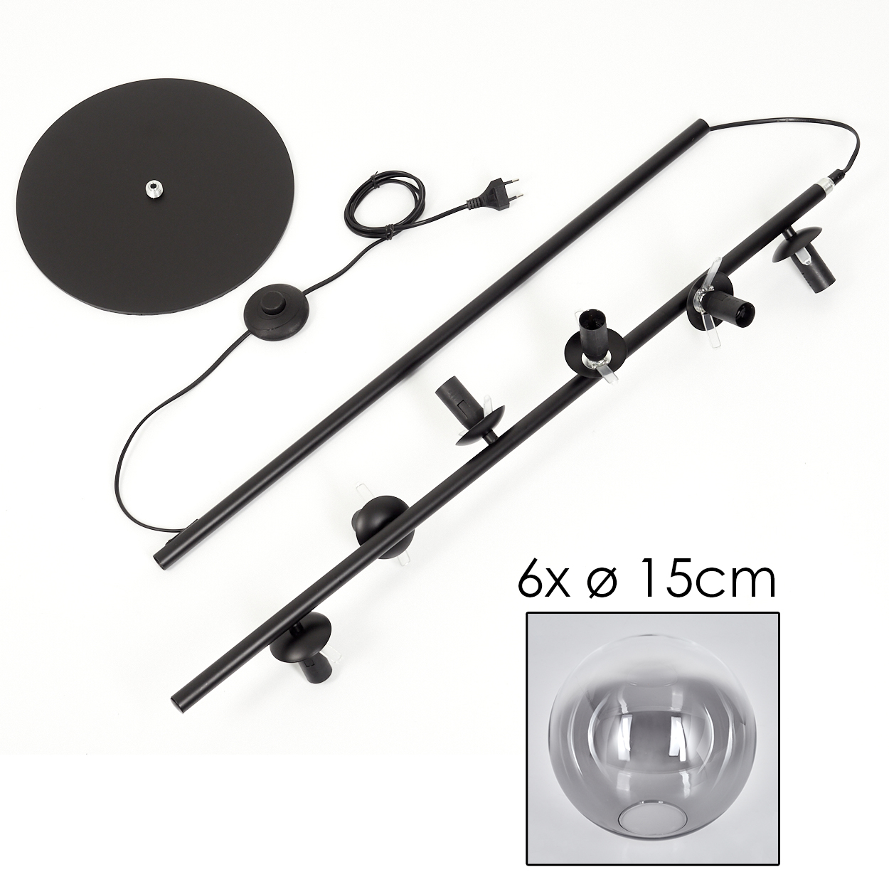 Eine zerlegte Stehlampe mit Glasschirm. Die Teile liegen auf einer weißen Oberfläche.