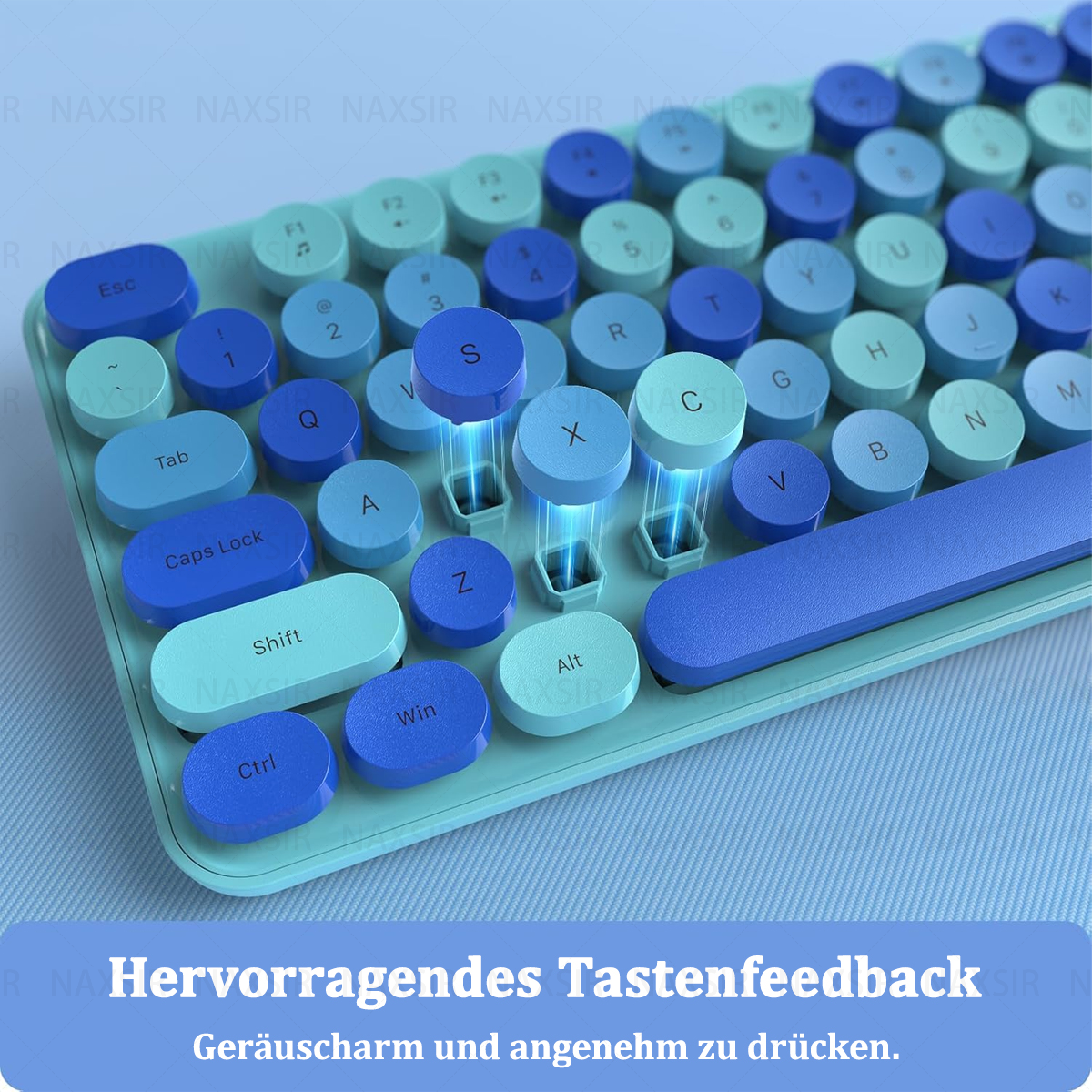Nahaufnahme einer retro-Tastatur in Türkis und Hellblau.
