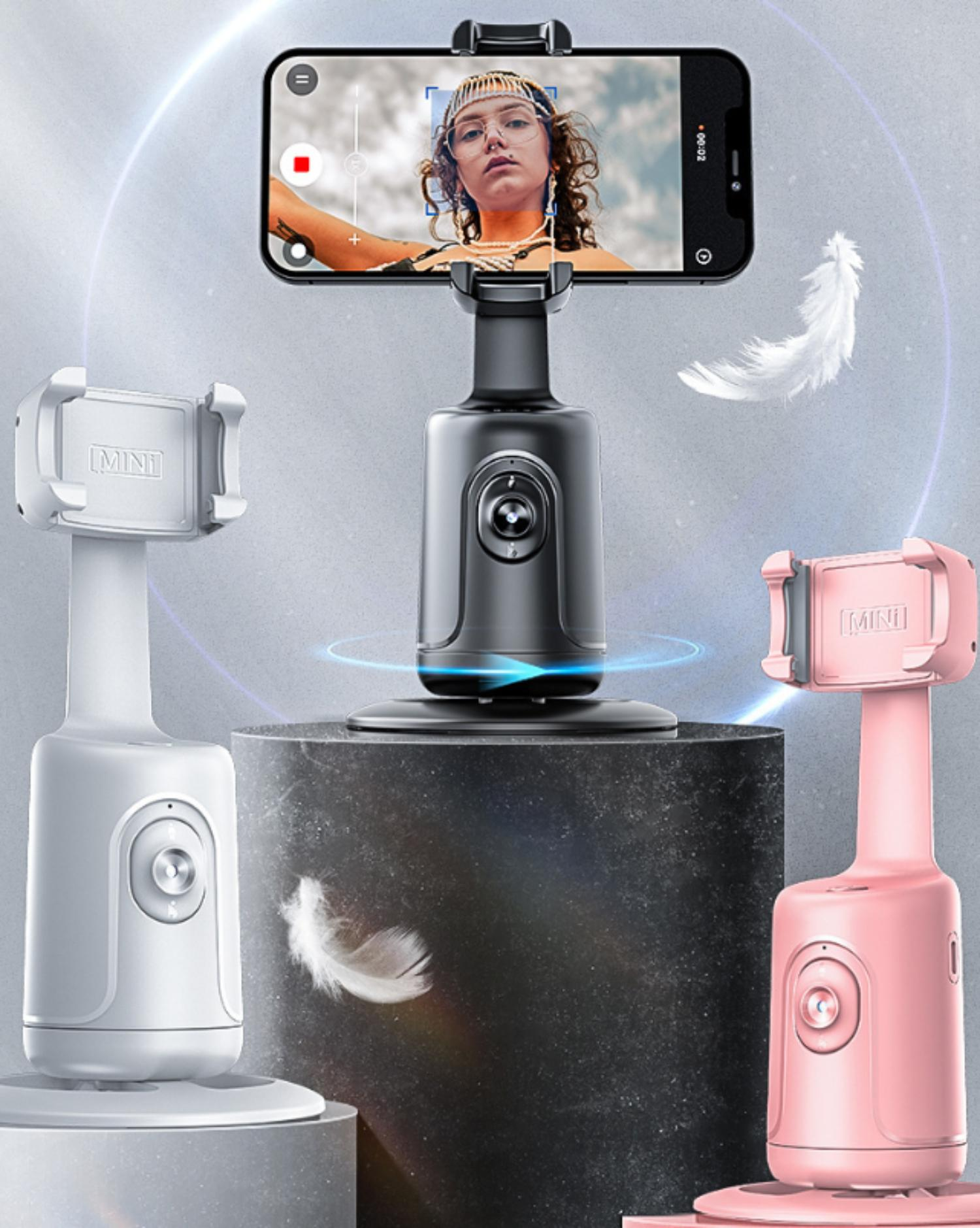 Drei Telefonständer in Weiß, Dunkelgrau und Rosa halten Telefone, wobei im Hintergrund eine weiße Feder schwebt.