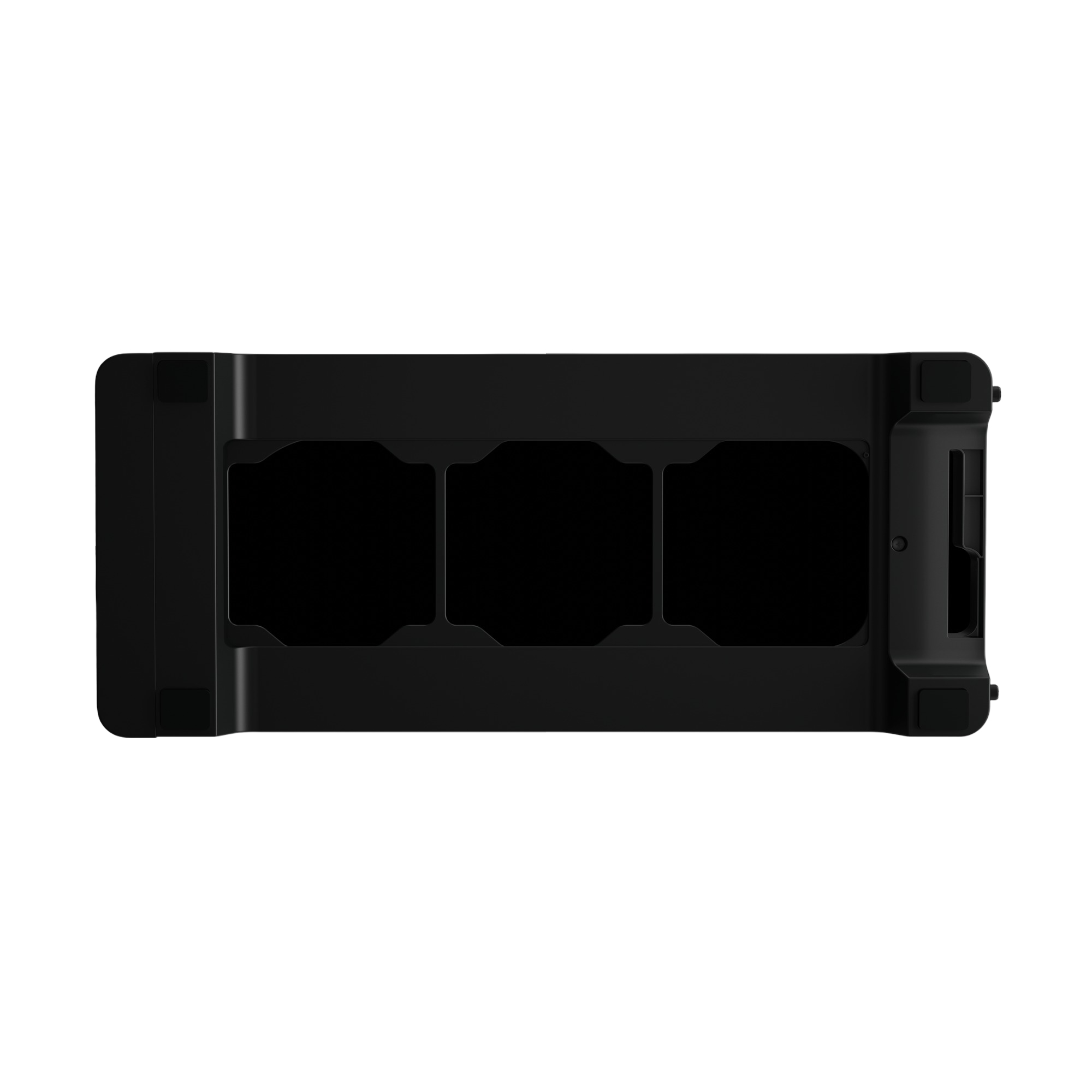 Widok z góry na czarne urządzenie z trzema zagłębionymi obszarami.