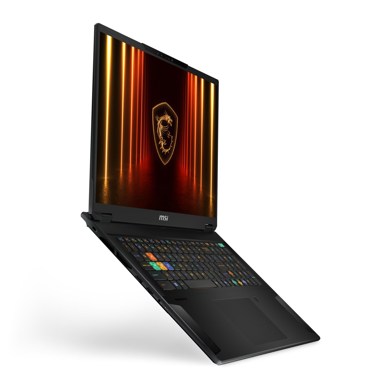 Un ordinateur portable MSI noir est ouvert, affichant un logo avec un dragon et des accents dorés. L'écran est éclairé par des lumières orange, en angle.