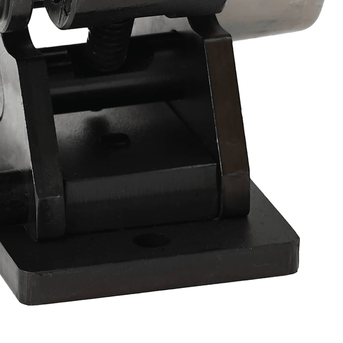 Primo piano della base di un utensile nero. Dettagli della struttura dell'utensile visibili.