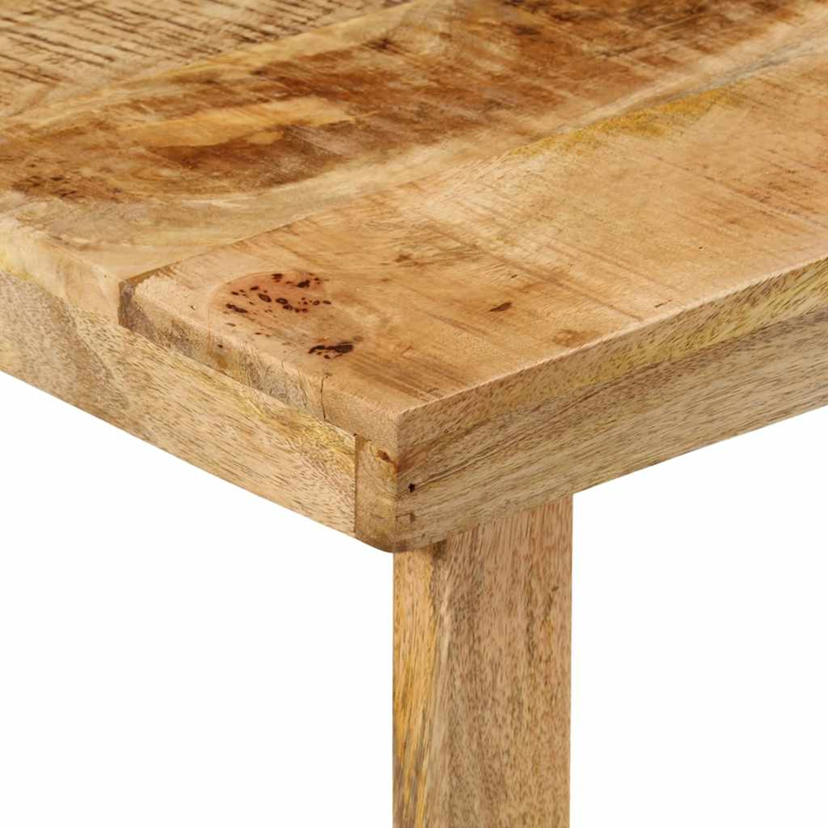Nahaufnahme einer Holztischecke. Das Holz hat eine natürliche Maserung und Textur.