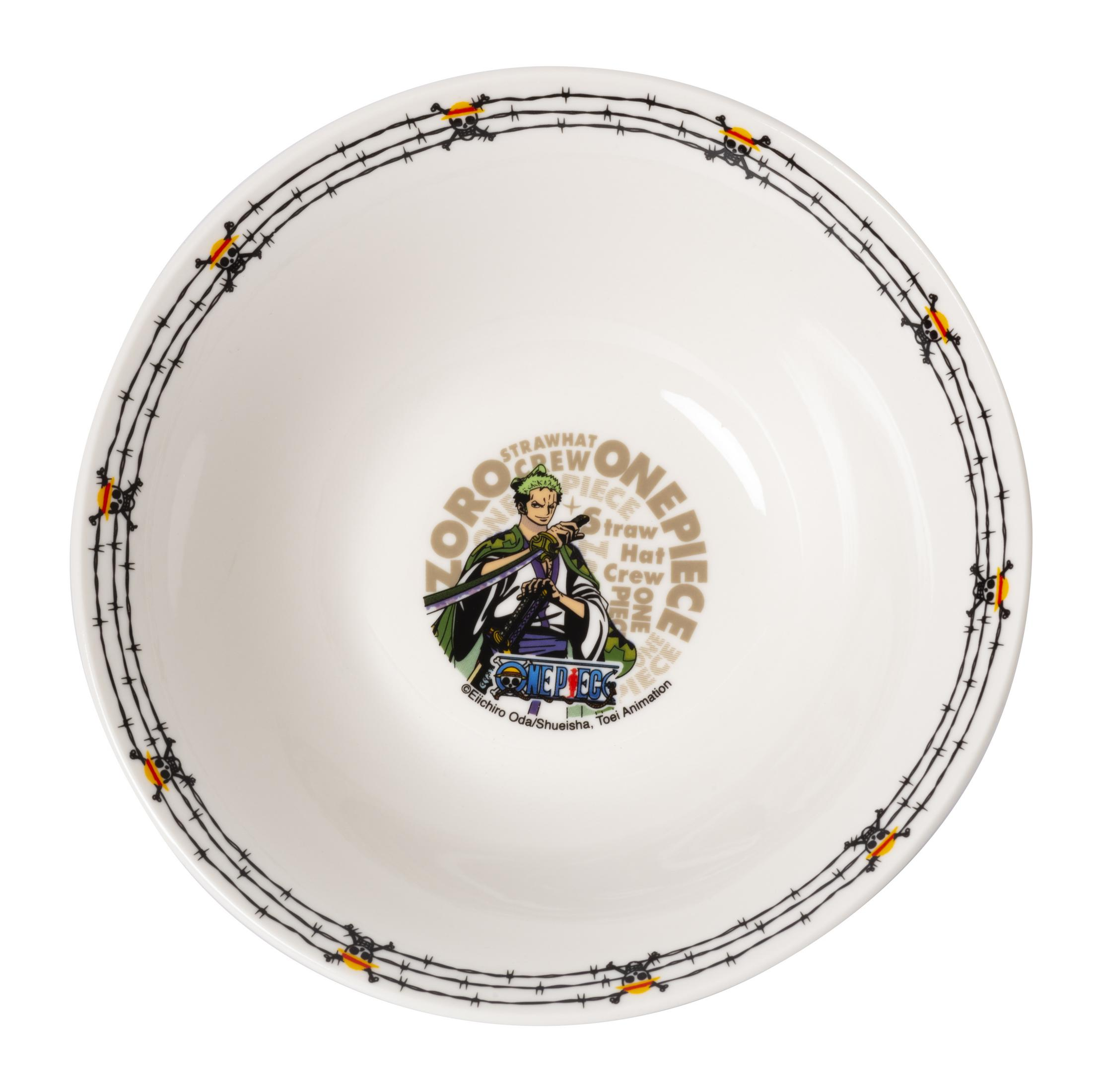 Eine weiße Schüssel mit einem One Piece Anime-Design in der Mitte und einem schwarzen Rand.