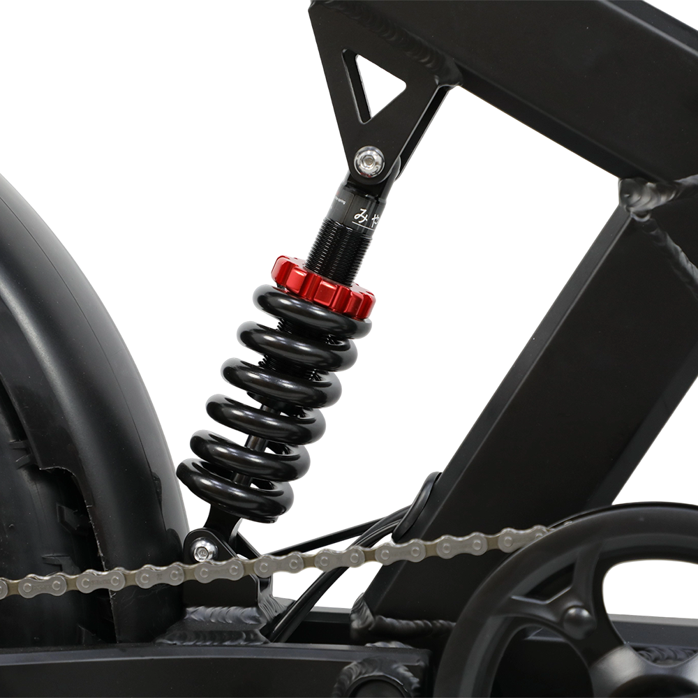 Schwarzer Fahrradstoßdämpfer mit rotem Einsteller, Feder und Kettendetail. Rahmen sichtbar. Weißer Hintergrund.