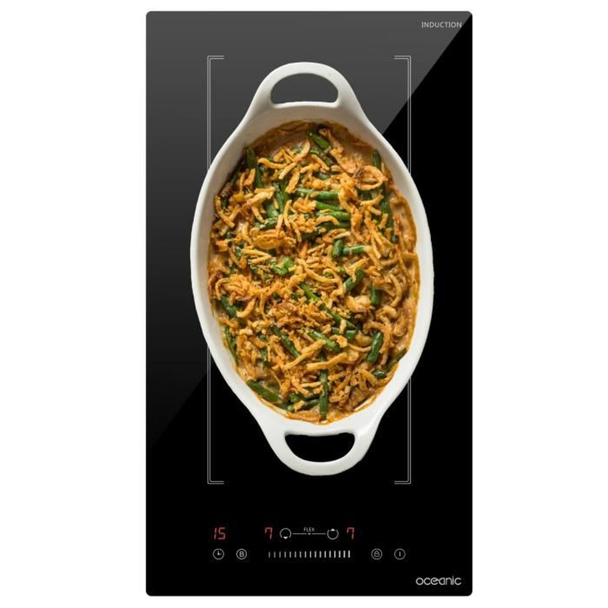A black induction cooktop with a casserole on it. It shows digital displays and touch controls.