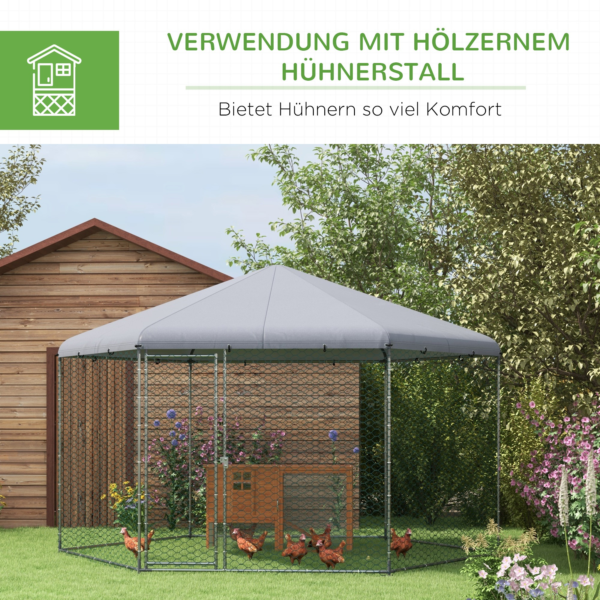 Hühner in einem umzäunten Gehege mit grauem Dach. Ein hölzernes Gehege ist drin. Grünes Gras umgibt es.