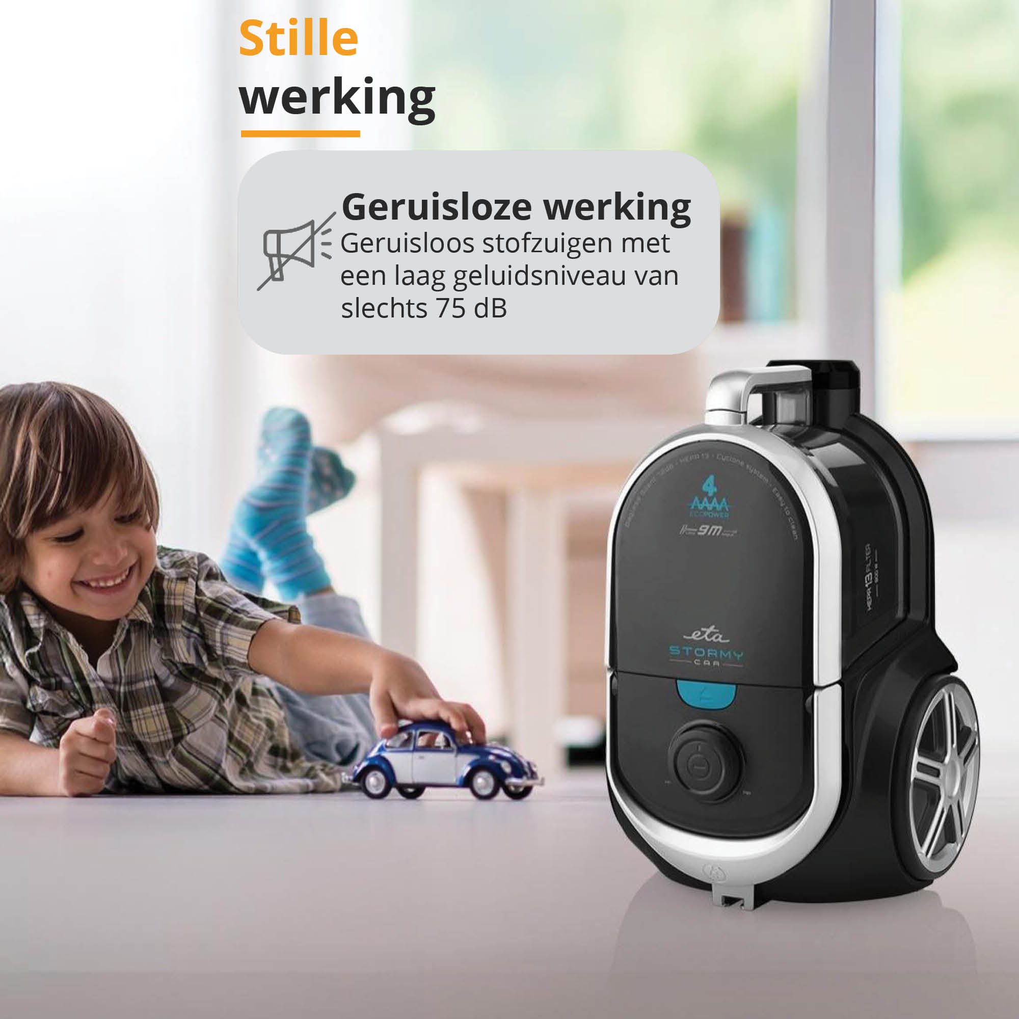 A child playing with a toy car next to a vacuum cleaner. Text bubble mentions quiet operation at 75dB.