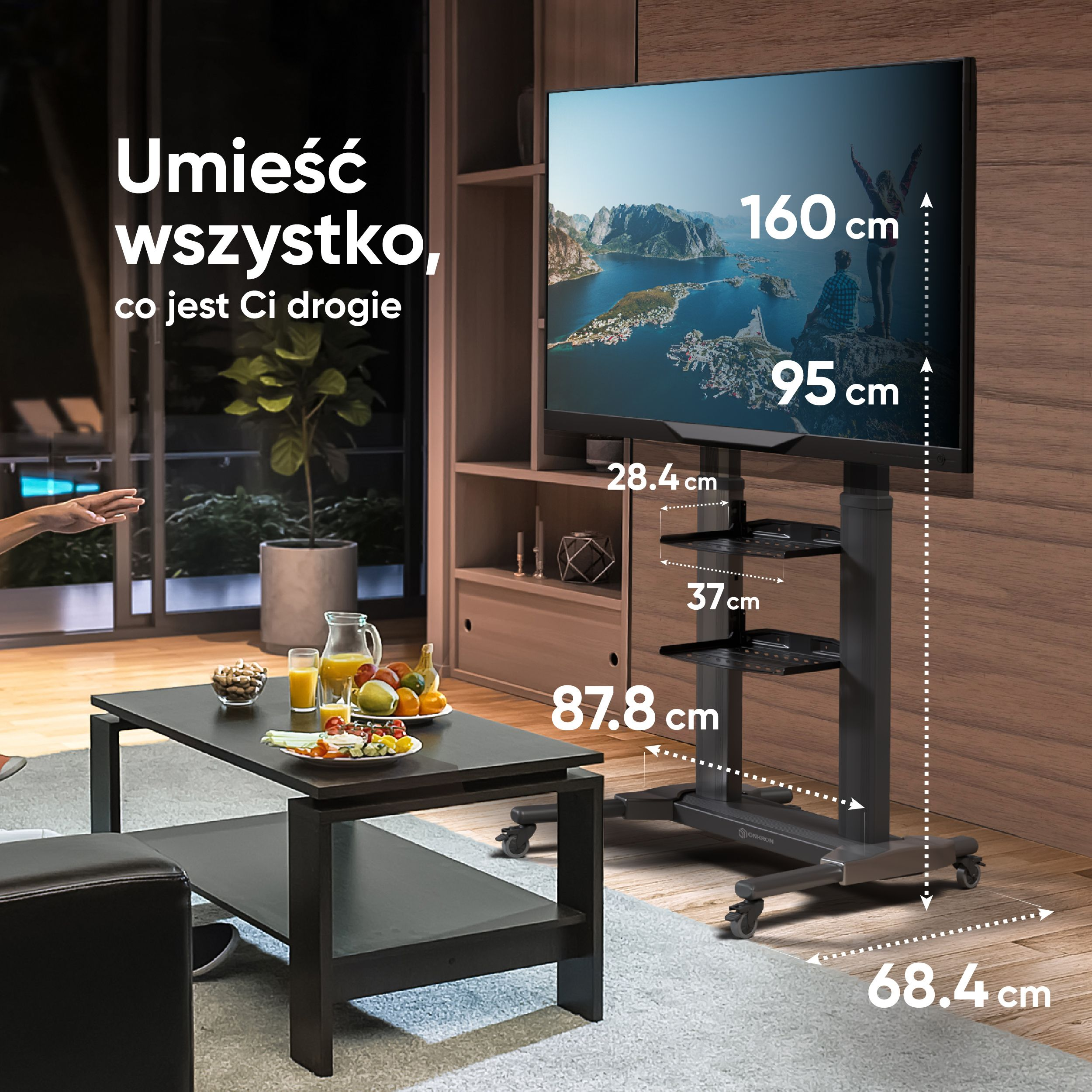 Telewizor na stojaku z wymiarami. Stół z napojami i przekąskami z przodu.