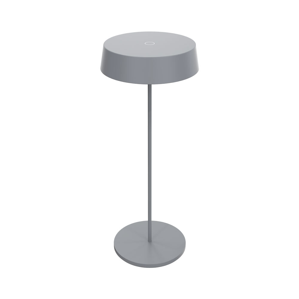 Una lampada grigia con paralume e base rotondi, su sfondo bianco.