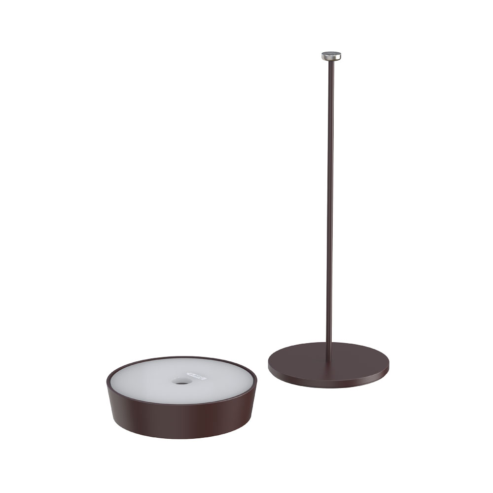 Due parti di una lampada, una base e uno stelo, entrambi in marrone. La lampada non è assemblata.