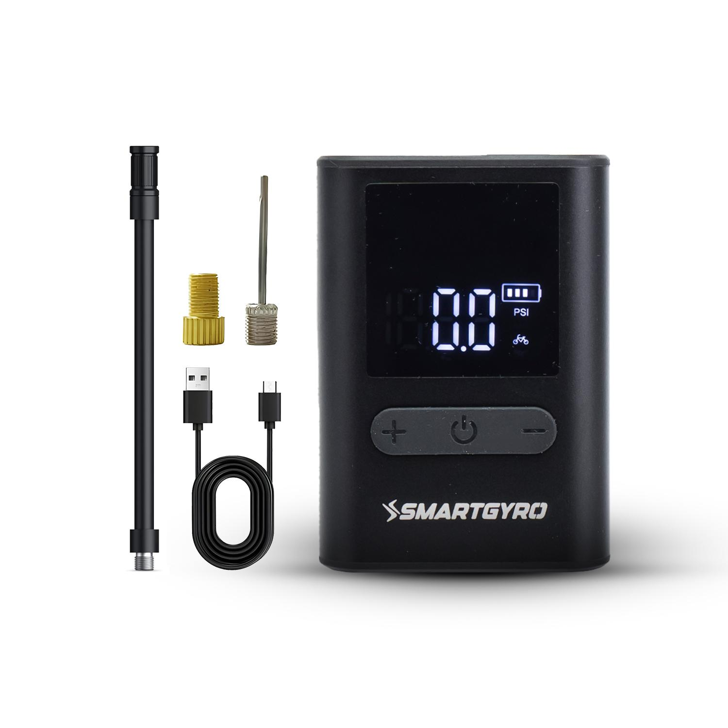 Inflador de neumáticos digital negro con accesorios. Incluye boquillas, cable USB y manguera.