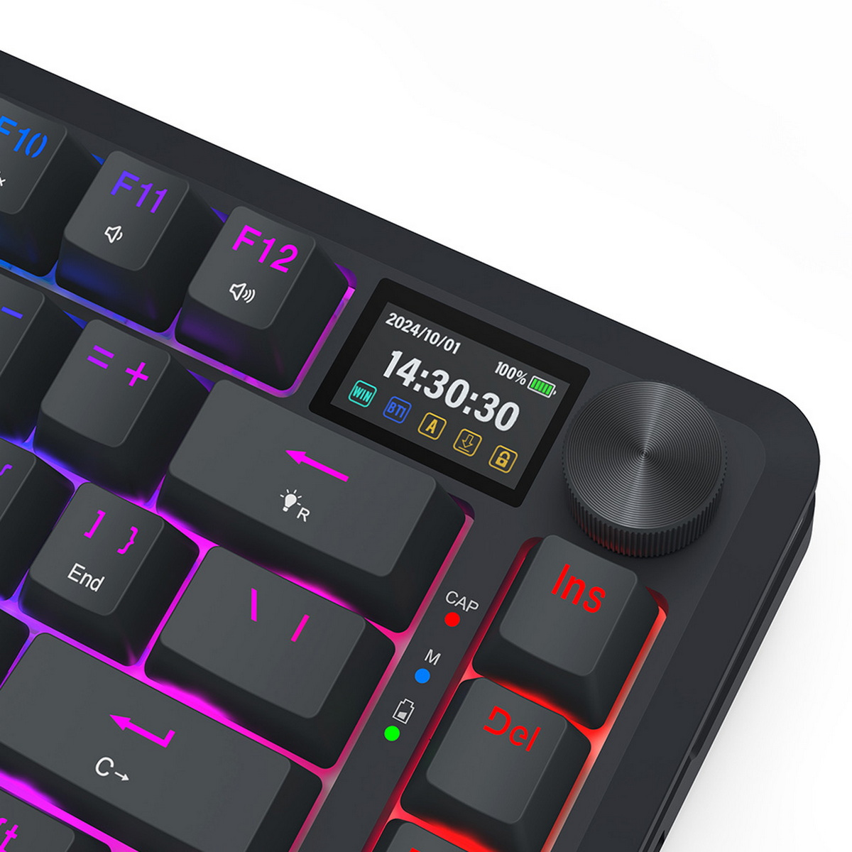 Primo piano di una tastiera nera con schermo LCD. La tastiera ha un'illuminazione colorata e una manopola di controllo a destra.
