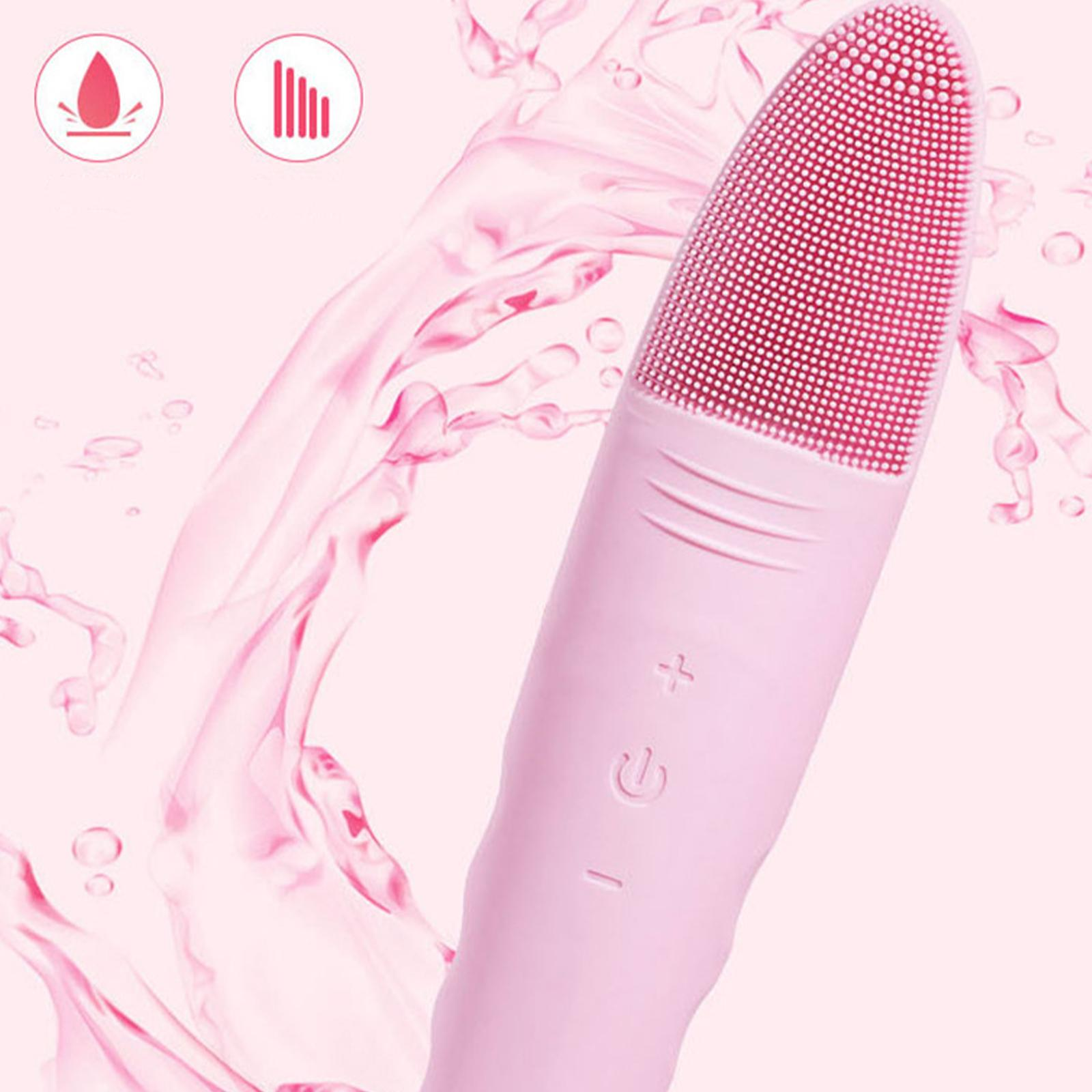 Rosa Gesichtsreinigungsbürste mit roten Borsten und einem rosa Wasserspritzer-Design auf rosa Hintergrund.