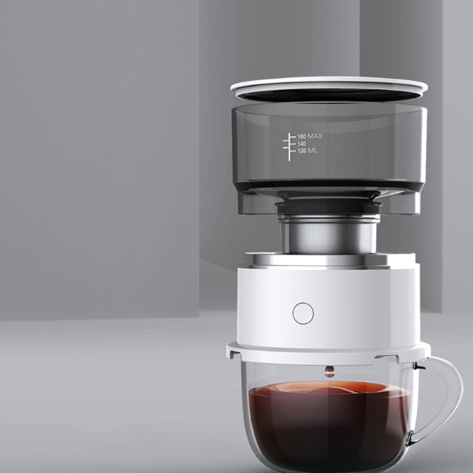 Kaffeemaschine. Sie besteht aus einer Glastasse und zwei grauen Komponenten.