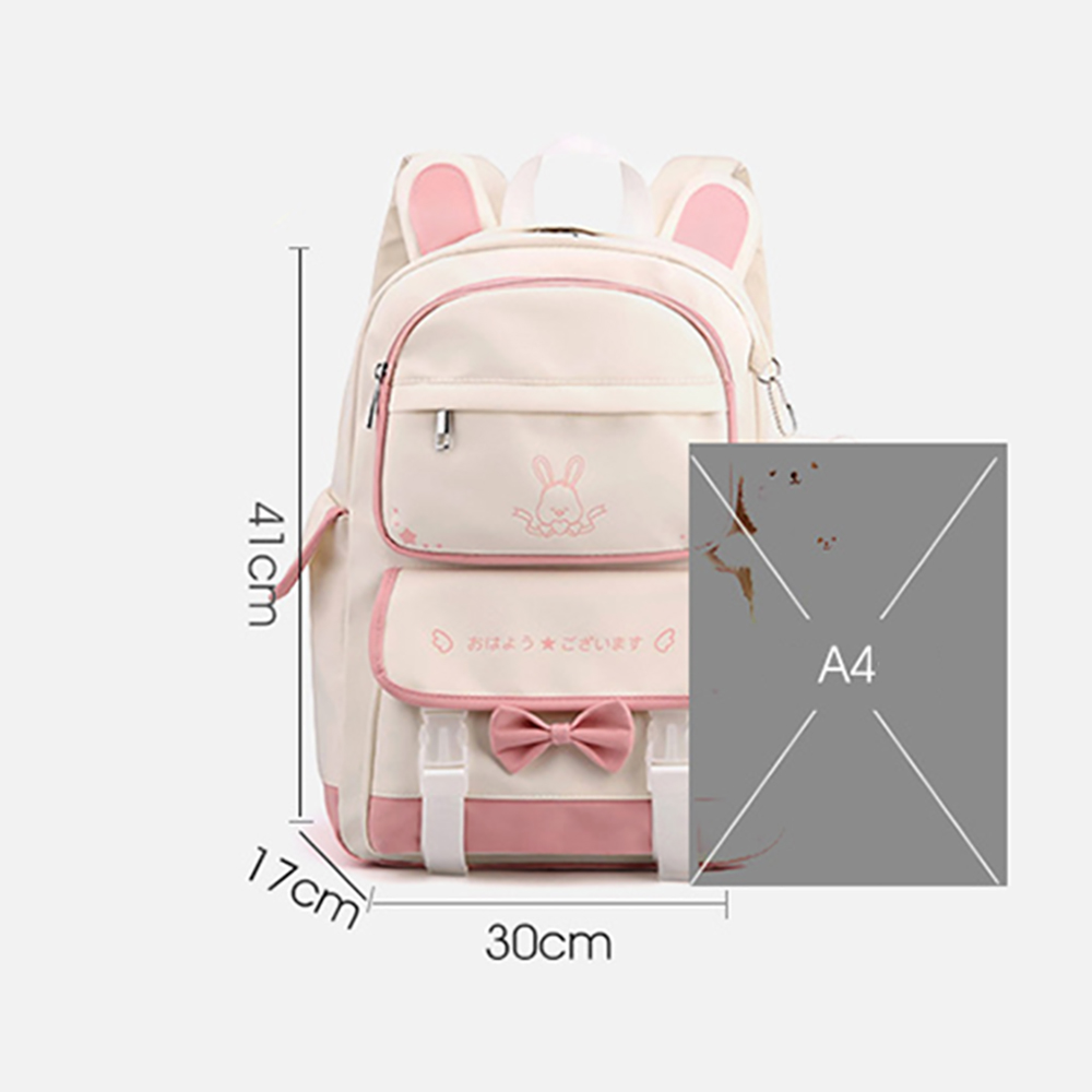 Weiß-rosa Rucksack mit Hasenohren, einer Schleife, und angegebenen Abmessungen.