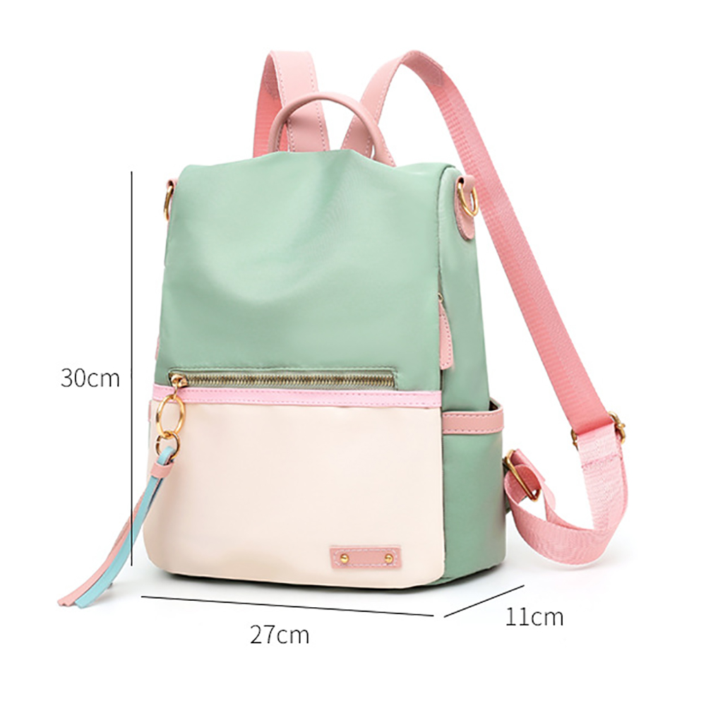 Minzgrüner, rosa und schwarzer Rucksack mit rosa Trägern und goldenen Details.
