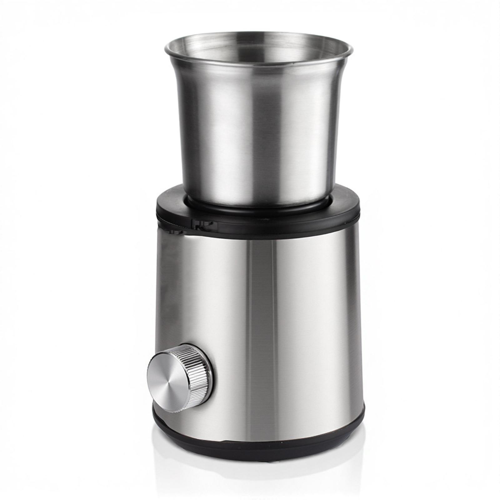 Kaffeemühle mit silbernem Gehäuse und abnehmbarem Oberteil. Es hat ein Rad zum Einstellen des Mahlgrades.