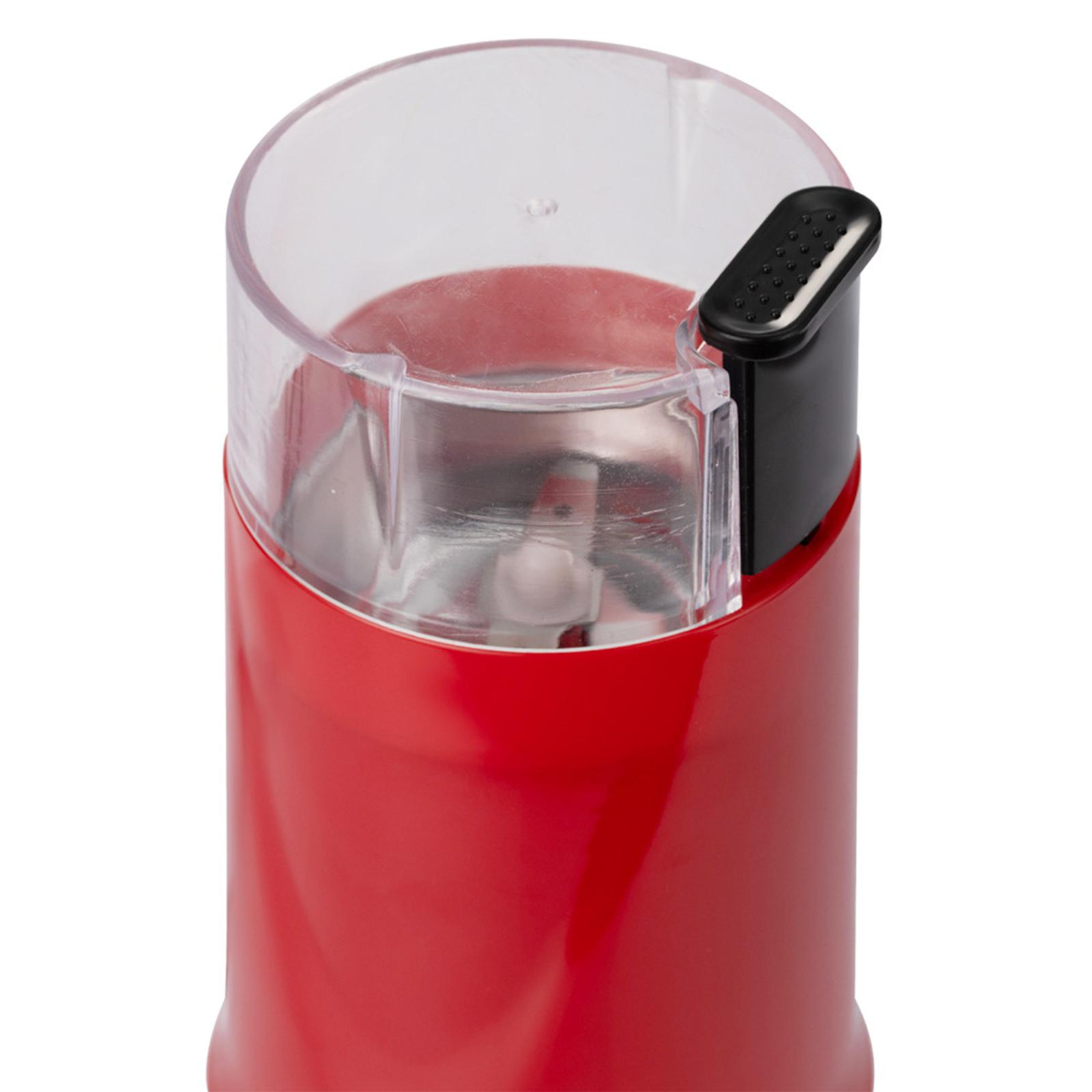 Rote Kaffeemühle mit schwarzem Deckel. Die Mühle hat einen transparenten Deckel und einen schwarzen Ausguss.